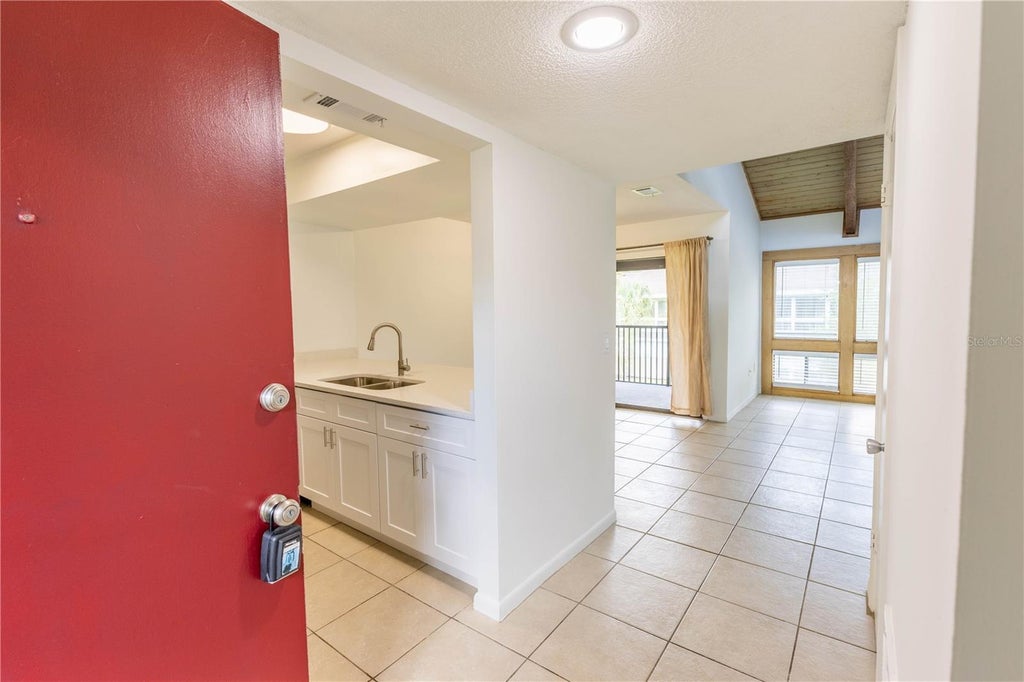 Photo of 6094 Peregrine Avenue #16C, Orlando, FL 32819 (MLS # S5157960)