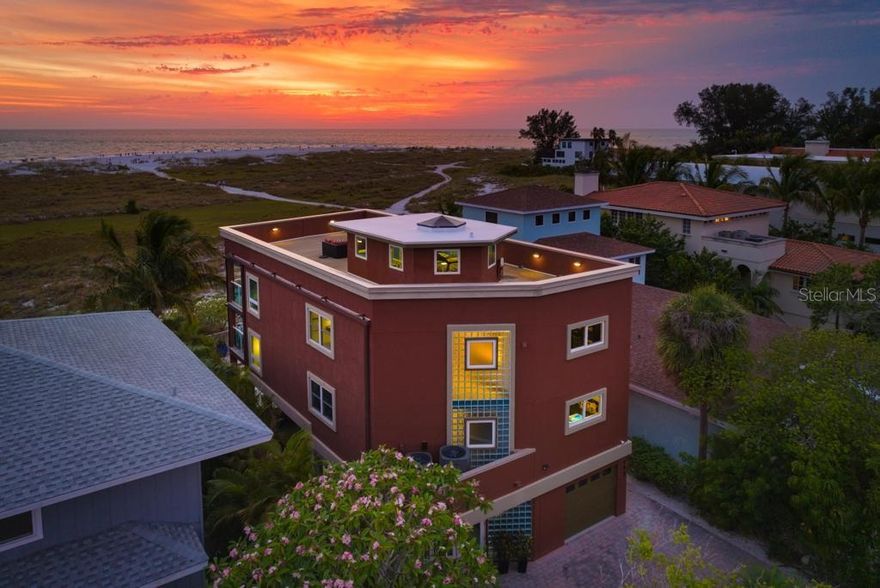 DIRECT BEACHFRONT HOME WITH A ROOF TOP DECK! This four bedroom, three bath pool home was remodeled in 2013 and is fully turnkey furnished.  With sweeping vistas of the azure waters, sandy beaches and sunsets, this direct beachfront home offers the possibility to create strong rental income and create cherished memories. This property is located in a short-term rental zone.  Experience the allure of beachfront living and discover the unparalleled beauty that awaits you on the highly coveted north end of Anna Maria Island.  Located in a weekly short-term rental zone that allows strong rental potential to grow your investment.  Upon entry into the foyer, you'll ascend to the main living area.  Full glass and an expansive deck enhance the natural beauty of the open living, dining and kitchen areas.  Accompanying the main level is a bonus room/study, a bedroom, and a full bath.  The next tier reveals 3 additional bedrooms, including two gulf front bedrooms that are graced by a second level deck spanning the breadth, along with a full modern bath, dual vanities, a soaking tub and large walk-in closet.  The serene bedrooms offer an oasis of comfort, each thoughtfully designed to provide tranquility.  The fourth bedroom and third full bath are also situated on the second level.  Additional upgrades include a saltwater pool and spa completed in 2022, two new air conditioners installed in 2023 and the exterior of the home was repainted in 2023. With tile and oak hardwood throughout and a vista so unique, one leaves here in awe of the location.  Every day will feel like a vacation as you embrace the coastal lifestyle and rejuvenate your senses.  Call for a private tour and embark on a journey to embrace the epitome of beachfront living.  Make this your very own coastal paradise today!