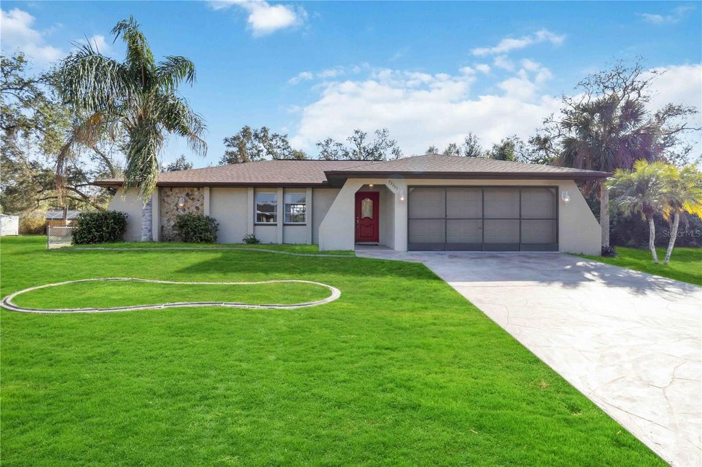 Photo of 22285 Walton Avenue, Port Charlotte, FL 33952 (MLS # OM717081)