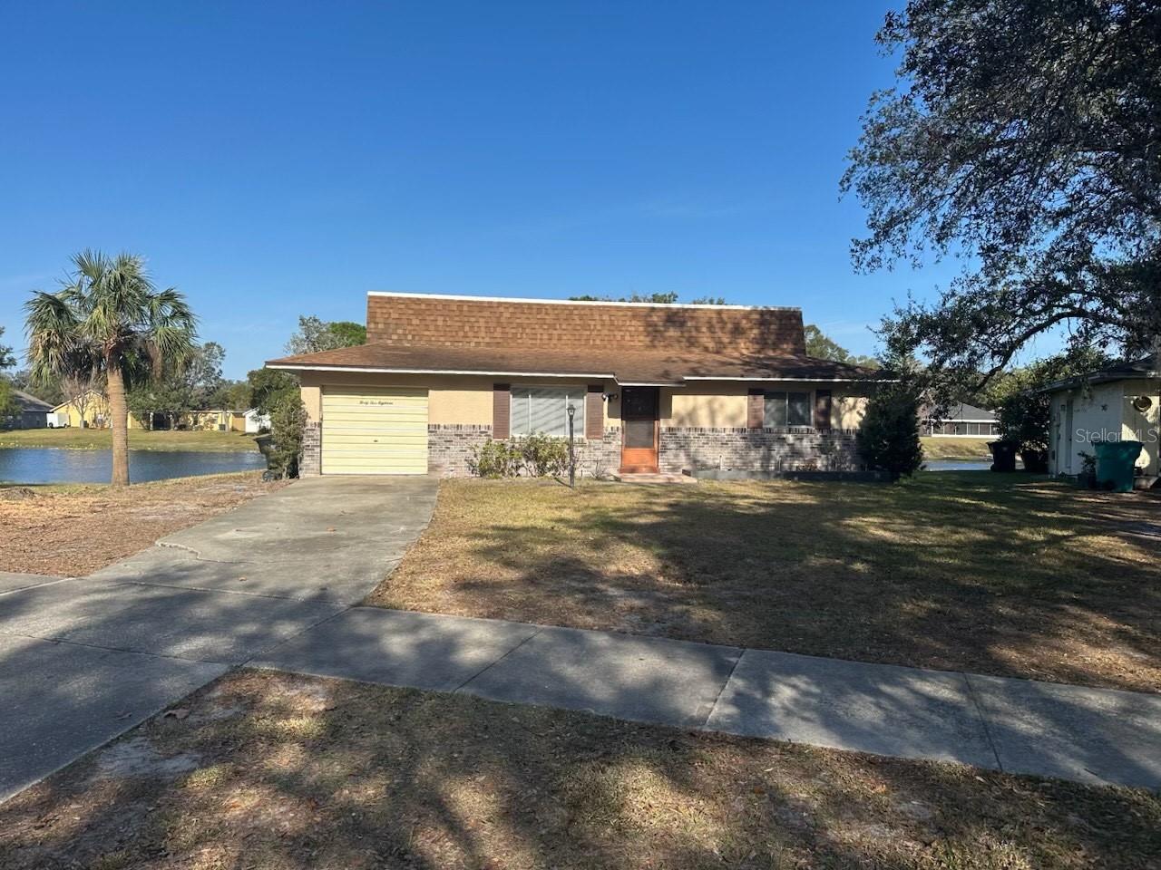 This 2 bedroom 1 and 1/2 bath home features a 1 car garage and is located on a lake front lot with panoramic nature views from the screened enclosed patio. Fresh, new paint in living room! This home also features an eat in kitchen with plenty of counter space which opens to the living room and screened patio! The master bedroom has a large vanity, and plenty of closet space. This home has a wide open floor plan and a great backyard for any occasion! Located only minutes to downtown Orlando, major highways, attractions, entertainment, dining, shopping & more!As part of Keller Williams' dedication to resident satisfaction, you'll have access to our exclusive Resident Benefits Package (RBP). This includes perks such as HVAC air filter delivery, renters insurance, credit-building opportunities, $1M Identity Protection, and utility concierge service, ensuring a stress-free move-in experience. Don't miss out on this exceptional opportunity!