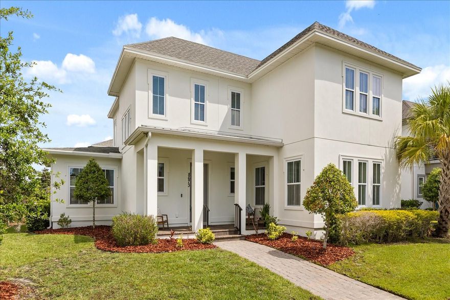 Welcome to this stunning executive Laureate Park home by Ashton Woods, featuring the highly sought-after Anderson floor plan on an estate-sized corner homesite with a rare detached 3-car garage apartment. Ideally located just two blocks from the community’s premier amenities, this home offers the perfect blend of luxury, flexibility, and convenience.

A charming front porch welcomes you inside, where hardwood floors span the entire first floor and staircase. The bright, open-concept layout is filled with natural light and highlighted by soaring ceilings in the family room, creating an elegant and airy atmosphere.

The chef-inspired kitchen showcases ceiling-height gray shaker cabinetry with soft-close drawers, quartz countertops, a modern glass subway tile backsplash, a spacious center island, and built-in stainless steel appliances—perfect for both everyday living and entertaining. A versatile sunroom off the family room offers the ideal space for a formal dining area or relaxing retreat.

The first-floor primary suite is a private sanctuary, featuring a spa-like bath with dual vanities, floor-to-ceiling tile, a frameless glass rain shower, and a large walk-in closet. Upstairs, you’ll find a cozy loft along with well-appointed secondary bedrooms, including a mix of shared and en-suite bath layouts.

Step outside to enjoy the oversized corner homesite, offering ample space to design your dream outdoor oasis, including room for a pool.

The standout feature is the detached 3-car garage apartment, upgraded beyond the standard with luxury laminate flooring, a stylish subway tile backsplash, and a designer bathroom with octagon tile flooring—ideal for guests, in-laws, or income-producing rental potential.

Residents of Laureate Park enjoy resort-style amenities including three pools, fitness center, basketball courts, dog parks, playgrounds, scenic trails, and vibrant community events, along with dining at Canvas Restaurant & Market. Conveniently located near top-rated schools, Publix, and just minutes to Boxi Park, this home offers an unmatched lifestyle in the heart of Lake Nona.