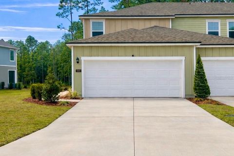 Photo of 287 Redbud Road, Palm Coast, FL 32137 (MLS # V4946282)
