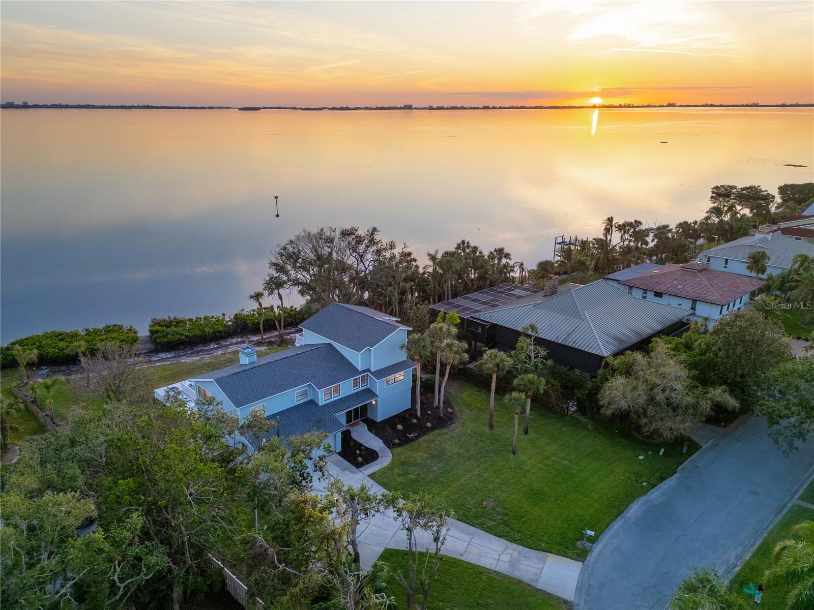 Welcome to 3804 Bayside Drive! Situated directly on Sarasota Bay, this luxurious, half acre, direct bay front home with over 5200 square feet of living space offers 4 bedrooms 3.5 baths, 2 car garage, heated pool and sweeping bay views that are absolutely stunning! Whether you’re taking your morning coffee from the master suite deck enjoying the sunrise, or indulging in cocktails on the main deck watching the sun set, the views are mesmerizing and offer a spectacular backdrop for the perfect coastal lifestyle. Adding to the appeal of this stunning coastal retreat are numerous outdoor living spaces providing for an array of uses and enjoyment to fill your day. Imagine lounging on the sun shelf in your heated pool, relaxing or dining on the covered patio area, sunning on the elevated pool deck or using any one of the multiple decks that offer extended living and entertaining areas but also provide privacy to enjoy reading a book or just taking in the magical views and wildlife. With amazing bay views from almost every room, this home provides a versatile and functional floor plan. The entry level provides its’ own living space, bedroom and full bath, perfect as an in-law suite, teen suite or as a private guest suite perfect for those extended stays. As you ascend the stairs, entering the formal living room with expansive vaulted ceilings, you'll be welcomed by sweeping bay views. You might want to stop and take a moment to really indulge in that view! The formal living and dining room are separated by a unique double sided wood burning fireplace creating a beautiful setting for any occasion. The huge executive chef sized kitchen is ready for you to let your dreams run wild with all the design possibilities this kitchen has to offer to make it uniquely your own. On this level, there are also two spacious bedrooms, each with walk-in closets, a family room, laundry room, and a beautifully renovated guest bath with a sleek and clean design. The third level is all master suite which you may never want, or need, to leave! And with its unparalleled bay views it’s a great place to both start and end your day. There's an adjacent space affectionately called “The Observatory” with built-in book shelves and sink, creating a functional space offering multiple use opportunities. But the master bath…it’s to die for! A large step in shower with multiple shower heads, a soaking tub, his and hers sinks/vanities with a clean sleek design consisting of marble flooring and surrounds create a calm and luxurious spa like feel. You will really appreciate preparing for the day in this space. And as if this home needs any thing more to offer, there’s a HUGE climate controlled storage room which is truly awesome. The opportunities for this space are endless. Keep it as storage, create a home gym, home office, game room, hobby room, Christmas tree room, or even a man cave. This coastal retreat still needs a little love, but the bones are great and the slate has been wiped clean for you to continue to build upon to create your own coastal masterpiece. And the location can't be beat! It’s just down the road from IMG Academy Golf Club and just minutes to downtown Sarasota, beautiful beaches, dining, schools, shopping and so much more.