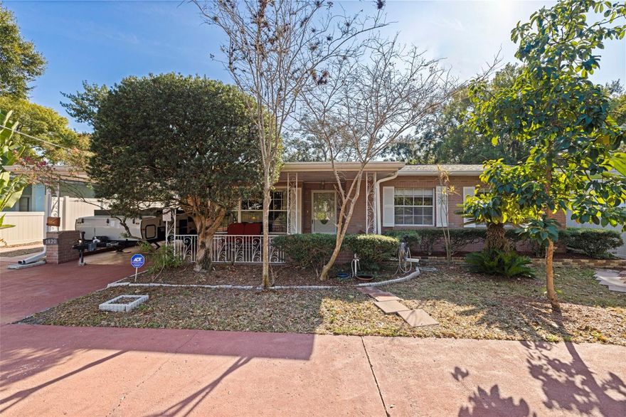 Live the Florida lifestyle in this spacious mid-century pool home with direct golf course views in Tampa’s North Side Country Club community, with views of the beloved Babe Zaharias Golf Course. This home offers the perfect blend of character, space, and opportunity. Built in 1954, this home is being sold by the second ever owner! While cosmetic updates will allow you to make it truly your own, it has been maintained where it matters most.  The HVAC is a 2019, the whole home has been replumbed, as well as rewired, and 36 solar panels that keep electric costs around $15 per month.  With the essential systems already taken care of, you can put your energy into personalizing this mid-century home to make it uniquely yours. The home unfolds into a layout designed for connection: formal living and dining rooms, plus views of the pool and the fairway beyond. The kitchen features solid wood-core cabinetry, offering durability and charm with the potential to be refreshed to your taste. Throughout the home, the thoughtful floor plan supports everyday living as well as effortless entertaining. The accent wall made of real stone and the Ben Franklin wood stove add a warm, cozy focal point that sets this home apart from today’s newer builds. The split-bedroom layout provides privacy, and storage is abundant. Practical upgrades include an ADT security system, irrigation system, and the home is wired for a generator in case of power outages. Outside you can embrace the Florida lifestyle: a screened pool for sunny afternoons, a fully-fenced backyard perfect for pets or play, and avocado and mango trees that bring a touch of the tropics to your own backyard. A rarity in this neighborhood, the expanded, powered studio-style shed opens up endless possibilities—an art studio, home gym, workshop, office, game room, or workshop. Set in a sought-after community close to local dining, shopping, and everything Tampa has to offer, this home is more than a place to live, it’s a lifestyle waiting for your personal vision.