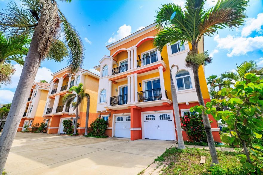 ISLAND LIVING, ELEVATED.

Welcome to your slice of paradise — a stunning 3-story townhome perfectly positioned between the tranquil Intracoastal Waterway and the warm, sugar-white sands of the Gulf of Mexico. This is Florida coastal living at its absolute finest.

Step through your private entry and you’ll find the first level offering a spacious bonus room — perfect for a home office, game room, or extra guest space — along with direct access to your oversized tandem garage, allowing room for two vehicles parked front-to-back with plenty of storage for all your beach gear, bikes, and paddleboards.

The main living spaces are thoughtfully elevated on the second and third floors — designed for peace of mind and worry-free waterfront living. On the second level, a gorgeous kitchen anchors the open-concept design, featuring high-end finishes, abundant prep space, and effortless flow for entertaining — whether you’re hosting a quiet dinner or a lively coastal gathering.

Every floor is wrapped in views. With balconies on both the front and back of the home, you’ll enjoy the best of both worlds — brilliant sunrises over the Intracoastal from your east-facing balconies (including one directly off the primary suite) and picture-perfect sunsets over the Gulf from your west-facing balconies. Four balconies in total offer endless fresh air, salt breezes, and panoramic views.

Upstairs, three generously sized bedrooms and three full bathrooms offer space for family and guests, with the primary suite serving as a private retreat complete with waterfront views, its own balcony, and spa-like ensuite bath.

Additional features include a private courtyard for outdoor dining and entertaining, a pre-plumbed elevator shaft for easy future installation, and the peace of mind that comes with elevated living in a waterfront setting.

Currently operating as a highly successful short-term rental, this property generates strong income with the current owners holding Superhost status on Airbnb — offering a rare turn-key investment opportunity with proven income history.

And the best part? You’re just steps from the warm Gulf waters, with world-class beaches, dining, shopping, and entertainment all moments away. Whether you're looking for a personal coastal retreat, an income-producing asset, or a bit of both — this one checks every box.