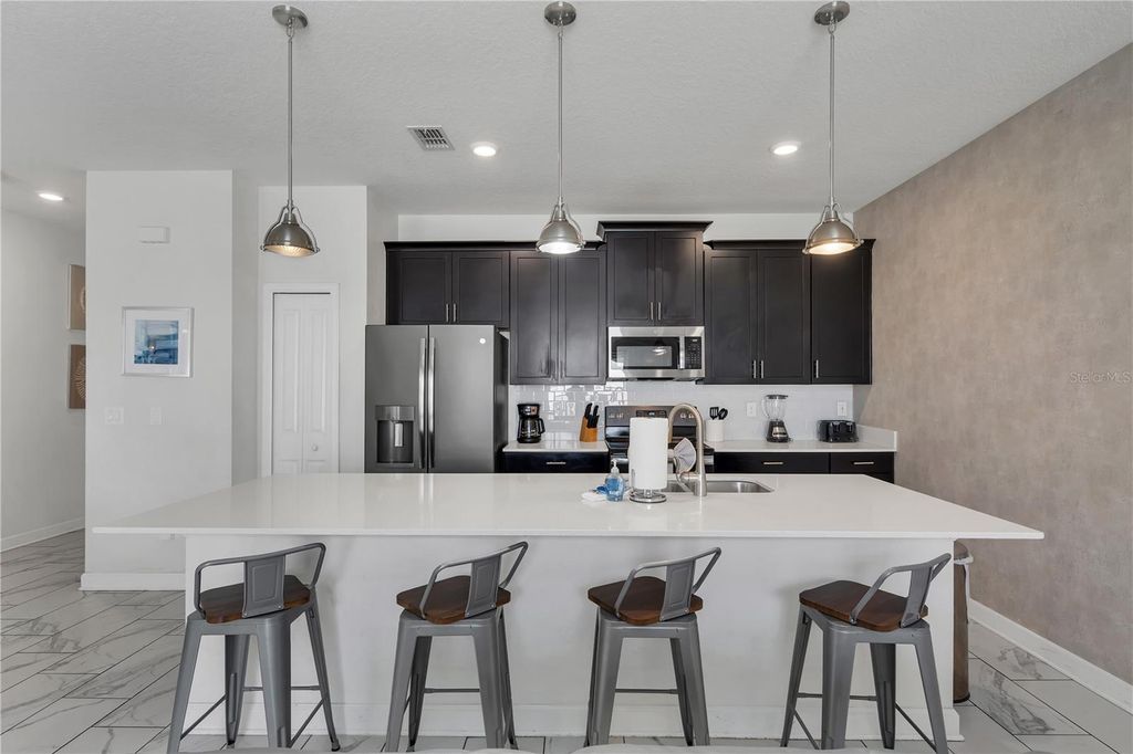 Photo of 9005 Stinger Drive, Davenport, FL 33896 (MLS # O6326505)