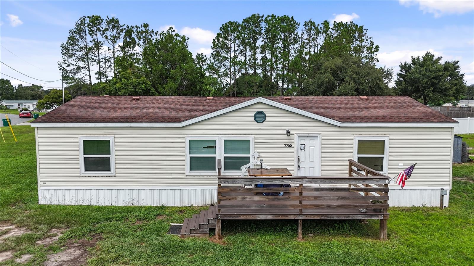 One or more photo(s) has been virtually staged. WELCOME TO OAKLAND HILLS – This 3-bedroom, 2-bathroom manufactured home sits on a spacious half-acre homesite with no HOA! You’ll love the freedom of living close to The Villages without the bond or monthly amenities fee. Imagine relaxing on your front porch, watching the sunset with a cocktail in hand, and enjoying the company of friends and neighbors who make this community special. Inside, the home showcases the true great room concept – with the kitchen, dining, and living spaces flowing together so you’re always connected, whether entertaining or simply enjoying everyday life. While this home is being sold As Is and offers opportunities for your personal touches, it is also an affordable chance to achieve your dream of homeownership in a location that puts you close to shopping, dining, and all that Central Florida has to offer. Bring your vision and discover the potential this property holds – the combination of space, location, and value makes it a rare opportunity!