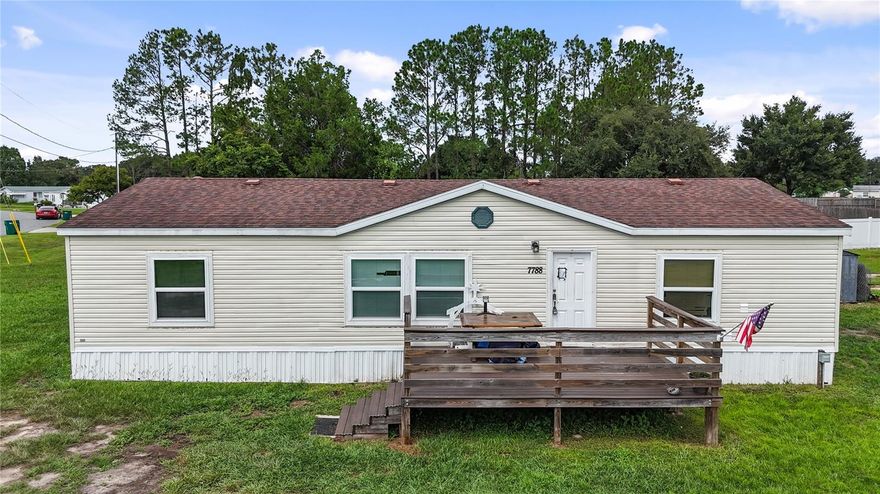One or more photo(s) has been virtually staged. WELCOME TO OAKLAND HILLS – This 3-bedroom, 2-bathroom manufactured home sits on a spacious half-acre homesite with no HOA! You’ll love the freedom of living close to The Villages without the bond or monthly amenities fee. Imagine relaxing on your front porch, watching the sunset with a cocktail in hand, and enjoying the company of friends and neighbors who make this community special. Inside, the home showcases the true great room concept – with the kitchen, dining, and living spaces flowing together so you’re always connected, whether entertaining or simply enjoying everyday life. Recent upgrades add incredible value and peace of mind, including a brand-new A/C system with all new ductwork under the home, hurricane-rated windows throughout, a roof replaced in 2019, new septic system lines expanded from two to four, and new tie-downs installed under the home in 2023. The kitchen features brand-new appliances, and outside you’ll enjoy a huge 10×16 deck that’s perfect for entertaining. For added convenience, the property also includes two 30-amp RV hookups with water and sewer connections. While this home is being sold As Is and offers opportunities for your personal touches, the major improvements have already been completed, making it move-in ready. Beyond the property, you’re just minutes away from The Villages’ shopping, restaurants, and entertainment. This is an affordable chance to achieve homeownership in a location that blends space, convenience, and updates you won’t often find at this price. Bring your vision and see the potential today!
