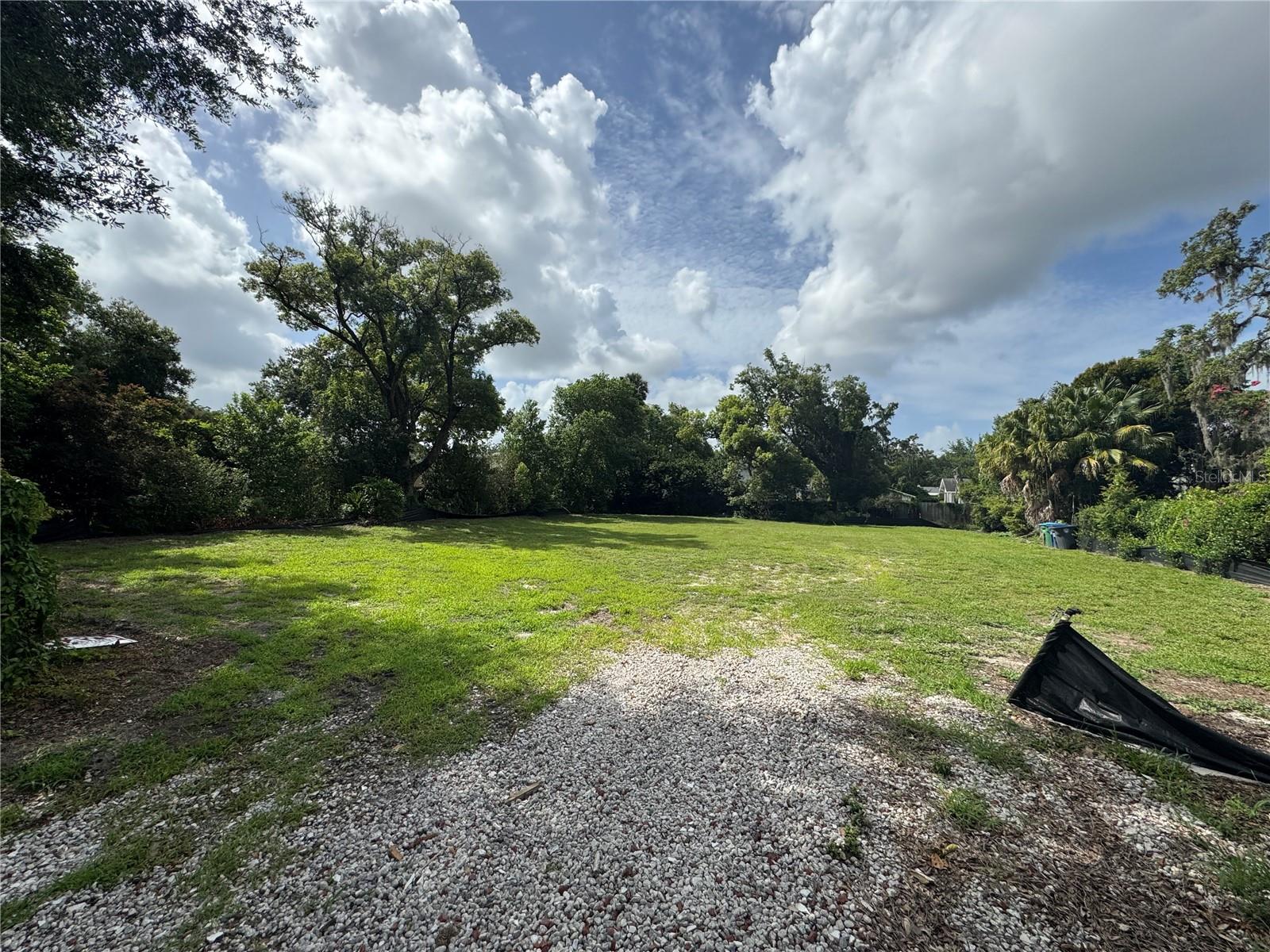 An oversized parcel of land ( 2 1/2 lots ) awaits on a picturesque, tree-canopied street near the Windsong neighborhood.
Build a large new Custom home, or given the substantial size of the lot, it might be feasible to pursue an approval to divide it into two separate parcels. If approved, this would provide a buyer with the potential to construct two individual homes - an outstanding prospect for investment.