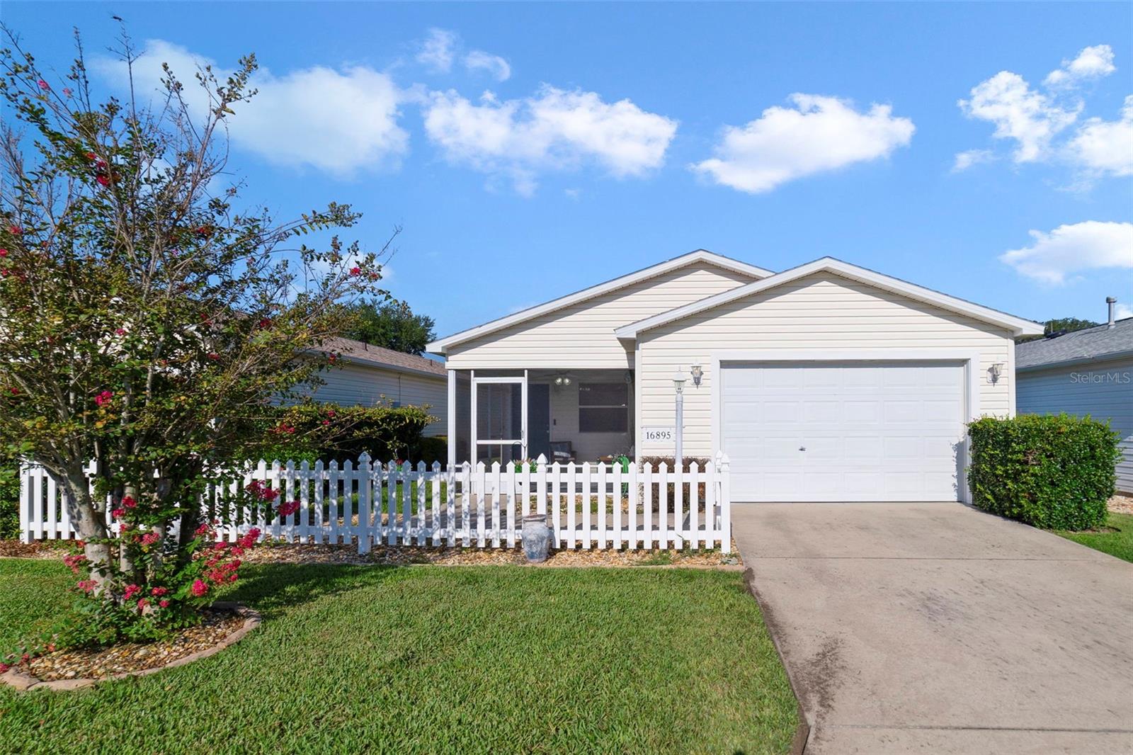 Ask about a lender provided rate buy-down credit on this home /// Seller may consider buyer concessions if made in an offer /// **BOND IS PAID!** Welcome to this adorable PATIO VILLA in the sought-after Village of Woodbury’s Sunnyside Villas – part of The Villages, Central Florida’s premier 55+ community! This charming home is MOVE IN READY and thoughtfully updated, offering comfort, convenience, and a timeless style. ***MAJOR UPDATES & IMPROVEMENTS*** The big ticket items have already been taken care of for added peace of mind, NEWER ROOF (2020), fresh MOHAWK CARPET (2021), BATHROOM UPDATES (2022), NEW A/C (2023), and energy-efficient LED LIGHTING in the kitchen and garage (2024). Most recently, the landscaping received a refresh with decorative rock accents in 2025, giving the exterior a crisp and welcoming look. ***INTERIOR FEATURES*** Step inside to an inviting OPEN CONCEPT main living space with WOOD LAMINATE FLOORING, crown molding, and plenty of natural light. The spacious EAT-IN KITCHEN features a GAS STOVE, breakfast bar, and generous counter space, while the dining area flows seamlessly into the living room for easy entertaining. ***OUTDOOR LIVING*** Enjoy your mornings or evenings from the front SCREENED PORCH, perfect for sipping coffee or relaxing with neighbors. Just one house away, you will find an open green space, an ideal spot for pets or a peaceful walk. ***LIFESTYLE & LOCATION** This villa comes FULLY FURNISHED, making it effortless to settle in and start enjoying all that The Villages has to offer. Sunnyside Villas is a quiet and friendly enclave with low utility bills and best of all NO BOND! You will be close to golf courses, recreation centers, swimming pools, sports courts, and parks, as well as everyday conveniences like shopping, dining, and the VA clinic – all just minutes away. ***WHY YOU WILL LOVE IT RECAP*** Updated baths (2022) ~ Mohawk carpet in bedrooms (2021) ~ New LED lighting (2024) ~ A/C (2023) ~ Roof (2020) ~ Fresh landscaping (2025) ~ Open layout with wood laminate floors ~ Crown molding & screened porch ~ Comes furnished, low utilities, NO BOND ~ Steps from green space, great for pets! Full of charm and move-in ready, this Sunnyside Villas patio home is the perfect spot to start your next chapter in The Villages. Call today to schedule a tour!