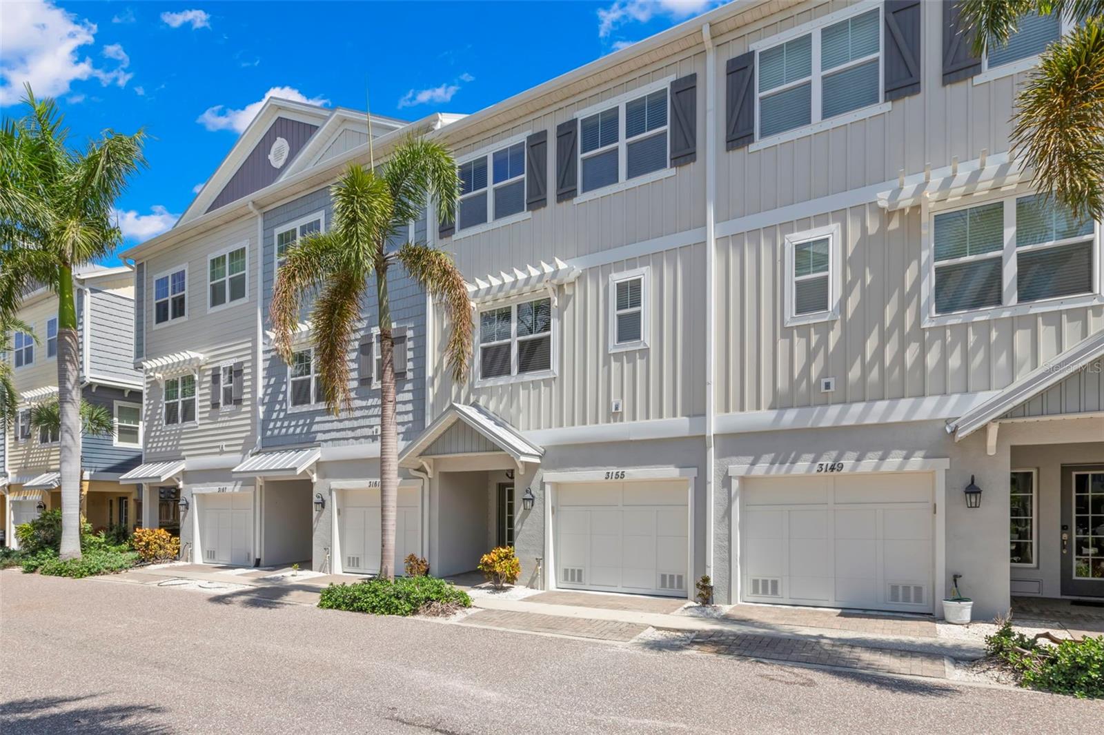 Discover coastal living in this luxury townhome, an exclusive gated marina community near Pinellas Point in St. Petersburg, FL. This home delivers unmatched quality and value for those seeking a permanent home, a vacation retreat or an investment property. Perfectly positioned just a 10-minute drive from downtown St. Petersburg, the property overlooks five acres of protected nature preserve, providing a tranquil setting with easy access to the water, the beach and all that St. Pete has to offer. Step inside to find contemporary finishes and fixtures throughout. Designed for both entertaining and everyday convenience, the open kitchen features stainless steel appliances, Cambria quartz countertops, an upgraded subway tile backsplash, and white cabinetry with clean, modern lines. This home also includes a bonus walk-in pantry space in the kitchen. The living and dining area boasts high ceilings, crown molding, and large sliding glass doors that lead to a screened lanai overlooking the nature preserve, providing indoor/outdoor space for relaxing or entertaining. Also on the main level, the versatile front room can be used as a formal dining room, office or an additional bedroom. The spacious half bath sits nearby for the convenience of you and your guests. The oversized primary suite on the third floor includes a walk-in closet featuring a customized California Closets system, crown molding and a cozy seating area with picturesque views of the preserve. The ensuite bath features a granite dual vanity, and a large glass-enclosed shower. Nearby the primary suite, a second walk-in closet also includes California Closets organization. The large laundry room, which is also positioned next to the primary suite, includes bonus cabinets for extra storage and organization. Two additional bedrooms and a third bathroom with a tub/shower combination and upgraded pedestal sink are also located on this level. The garage includes a bonus walk-in closet with wire shelving, a 4’x8’ overhead storage shelf, epoxy coated floors and is wired for electric car charging. Off the back of the garage, the extended paver patio provides more space to relax, grill or access the preserve walking path. This home offers a variety of ample storage options on each level, above and beyond most homes in this community. This townhome has been meticulously upgraded with professionally painted walls, upgraded lighting fixtures and closet organization systems. The pet-friendly community allows up to three pets with a combined weight limit of 100 pounds. Residents can enjoy premier amenities such as a resort-style pool, a full-service marina with wet slips and high and dry boat storage, a captain’s lounge, and easy walkability to the Freedom Boat Club with direct access to the nearby waters of the Gulf of Mexico, Tampa Bay, and Boca Ciega Bay. This community is near the Skyway Marina District and just minutes from downtown St. Petersburg, St. Pete Beach and the Sunshine Skyway Bridge, offering all the amenities of the coastal lifestyle you’ve been dreaming of. Schedule a private showing to experience coastal living in a welcoming community and great location!