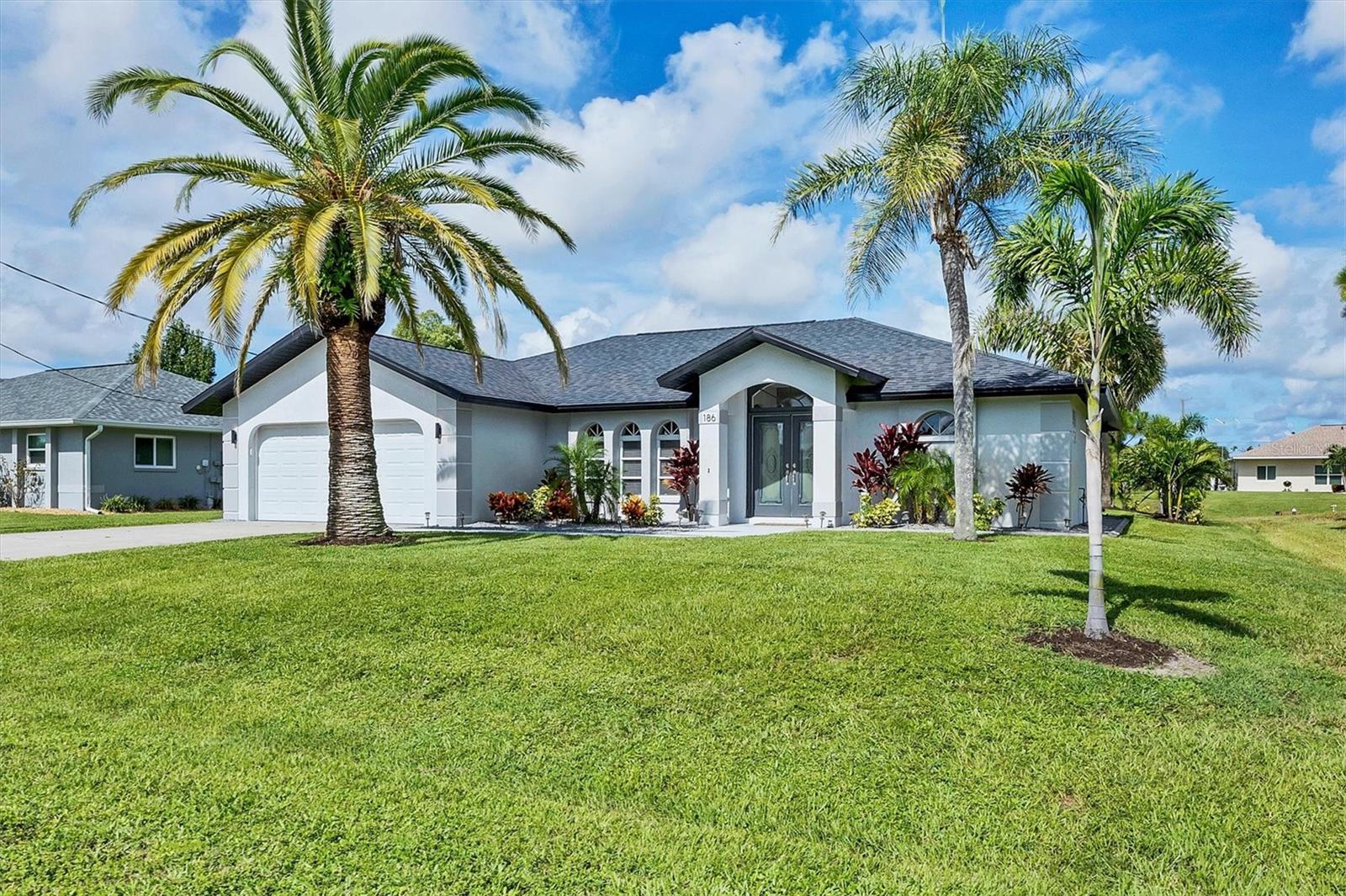 Welcome to your dream coastal retreat! This charming 3-bedroom, 2-bathroom home offers the perfect blend of comfort and style. With 1,835 square feet of living space, this residence is designed for both relaxation and entertainment. The open floor plan seamlessly connects the living, dining, and kitchen areas, creating a spacious and inviting atmosphere. Step outside to your waterfront oasis, featuring a screened heated pool and covered lanai, perfect for year-round enjoyment. The home is complemented by luxury vinyl plank flooring, updated kitchen and baths, stone counters throughout, and hurricane shutters providing peace of mind during stormy weather. The roof is only 3 years old, HVAC, electric pool heater and sprinkler pump are 1 yr old, appliances only 2 years old. Public water, public sewer, water for irrigation from the canal, and no need for flood insurance. You will love the location, surrounded by golf courses and just 20 minutes to the beaches. Whether you're hosting a poolside gathering or enjoying a quiet evening indoors, this home is your perfect coastal escape. Don't miss the opportunity to make this beachy paradise your own!