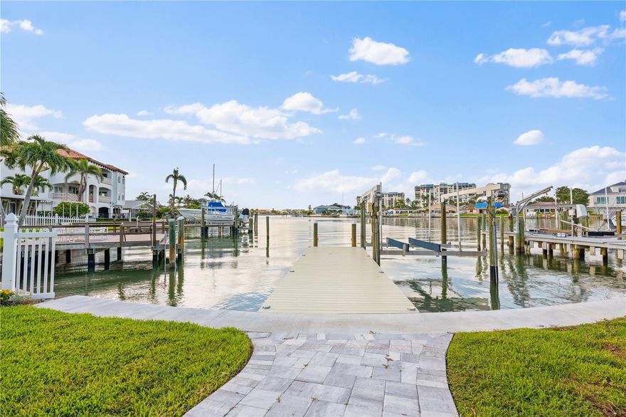 WATERFRONT LUXURY ON PARADISE ISLAND
Welcome to your COASTAL-CHIC RETREAT on Treasure Island’s desirable PARADISE ISLAND. Set on an OVERSIZED CORNER LOT with lush landscaping, this modern SINGLE-LEVEL HOME has been reimagined with LUXURY finishes and exceptional attention to detail—offering the ultimate BOATER’S LIFESTYLE just minutes from the GULF.
Inside, PANORAMIC WATER views steal the show through FLOOR-TO-CEILING HURRICANE-IMPACT windows and sliders (2024). Sleek 40x40 Tile floors (2025) stretch throughout the OPEN PLAN, where the living and dining areas flow seamlessly for ENTERTAINING. The CHEF’S KITCHEN shines with QUARTZ counters , custom wood cabinetry, premium stainless appliance, and an modern dry bar. 
The SPLIT-BEDROOM LAYOUT provides privacy for all. The PRIMARY suite features serene WATER and POOL views, patio access, and a SPA-LIKE bath with soaking tub, dual vanities, and glass-enclosed shower. Guest suites are equally well-appointed, including one with its own ENSUITE.
Outdoors, enjoy a resurfaced pebble TEC POOL, brand-new PAVER DECK (2025), and COMPOSITE DOCK with LIFT, NEW SEAWALL, and DEEP-WATER CANAL access. Additional upgrades include a HURRICANE-RATED garage door, new soffits and fascia, and upgraded insulation.
All this in a PRIME LOCATION near TREASURE ISLAND BEACH, WATERFRONT DINING, SHOPS, and the TREASURE BAY GOLF & TENNIS CENTER. Cruise by BIKE, GOLF CART, or BOAT, with easy access to DOWNTOWN ST. PETE. This home is the perfect blend of COASTAL LUXURY and FLORIDA LIFESTYLE.