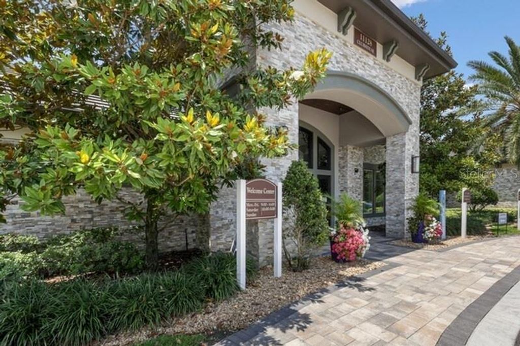 Photo of 11128 Grande Pines Circle #Palm, Orlando, FL 32821 (MLS # O6403302)