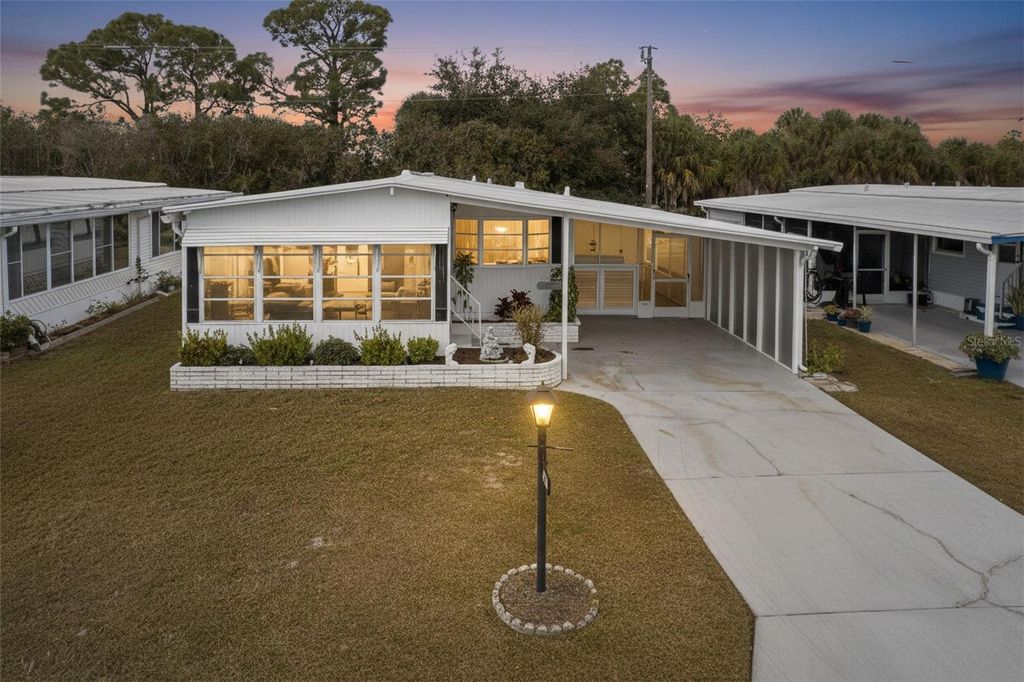 Photo of 228 La Costa, North Port, FL 34287 (MLS # TB8472544)