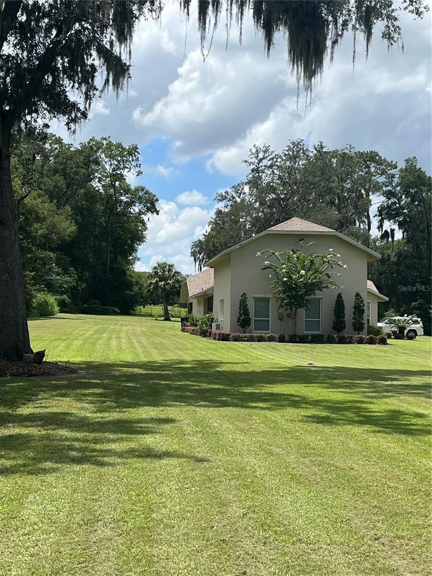 (INTERIOR/AERIAL/EXTERIOR PICTURES WILL BE UPDATED SOON) Nestled on 3.04 acres in the desirable SE Ocala area, this versatile agricultural property offers the perfect blend of space, functionality, and opportunity. Zoned A-1, the property is ideal for those looking to create a mini farm, bring animals, or enjoy the freedom of country living with no HOA restrictions.

The main residence features 3 bedrooms and 2 bathrooms, complemented by an attached 1 bedroom, 1 bathroom in-law suite with its own kitchen and private living space. This flexible layout is perfect for multi-generational living, guest accommodations, or potential rental income.

With a total of 2,966 square feet, the home provides ample room to live comfortably while enjoying the privacy and openness that acreage living offers. Built in 1994, the property has undergone extensive updates since 2021, including a new roof (2021), updated well system, oversized drain field, new A/C unit (2025), fresh interior and exterior paint, stucco exterior, and full landscaping. Interior improvements include LVP flooring throughout most of the main home, an updated kitchen with granite countertops, new sink, faucet, glass backsplash, and hardware, along with upgraded bathrooms featuring new cabinetry, fixtures, and finishes. Additional enhancements include new appliances, lighting, exterior doors, and a block wall courtyard separating the main home and in-law suite.

Surrounded by larger parcels under common ownership, the property offers added privacy and a peaceful setting. Conveniently located approximately 25 minutes from the World Equestrian Center and HITS Ocala, this property is well-positioned for equestrian enthusiasts or those seeking proximity to Ocala’s premier horse venues.

Whether you are looking to establish a mini farm, invest in an income-producing setup, or simply enjoy the benefits of rural living with close access to town, this property offers exceptional potential.

Furniture and equipment may be available separately.