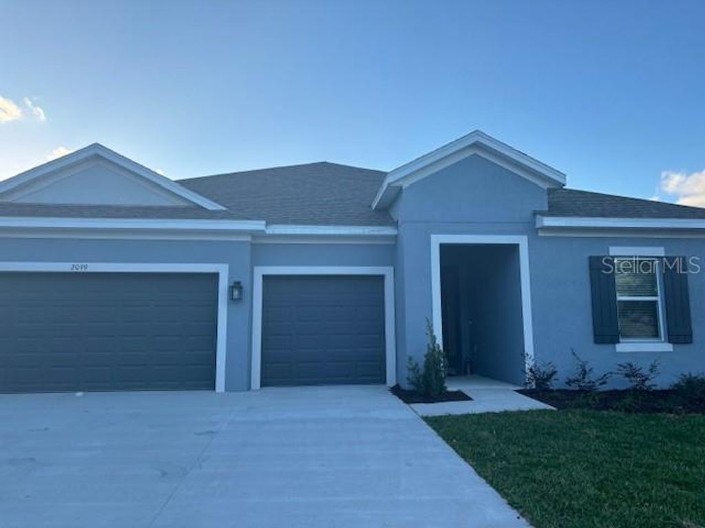 Photo of 2099 Mizzen Way, Wesley Chapel, FL 33543 (MLS # J971335)