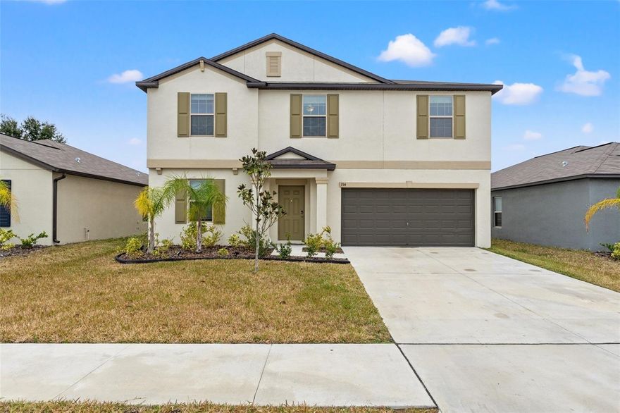 One or more photo(s) has been virtually staged. Welcome to 194 Argyll Drive in the highly desirable Villages of Avalon – Isle of Avalon, where modern comfort, flexible living space, and everyday convenience come together in this beautifully maintained 2022 Lennar-built home. Offering 5 bedrooms, 2 full bathrooms, a main-floor powder room, and nearly 3,000 square feet, this two-story home was designed for today’s evolving lifestyle.

The open-concept main living area features high ceilings, granite countertops, ceramic tile flooring, upgraded media-height electrical placement for TVs, and a large walk-in pantry. The first-floor primary suite offers added privacy with no living space above the bedroom or main living area and includes custom walk-in closets, dual vanities, and a spacious walk-in shower. A downstairs den/office with 8-foot lockable barn doors creates the ideal flex space for remote work, hobbies, or guests.

Upstairs features a spacious loft, four additional bedrooms, custom closets in two bedrooms, a dual vanity bathroom with tub, and additional storage throughout. Enjoy the fully vinyl-fenced backyard with walk-through gate, paver patio, sloped yard, ceiling fans throughout, inside utility room with washer and dryer included, and a 2-car garage. Conveniently located minutes from the Suncoast Parkway, Publix, shopping, dining, and community amenities including a pool, clubhouse, fitness center, sidewalks, parks, and walking trails. Assumable VA loan available for qualified buyers. Available for sale or lease.