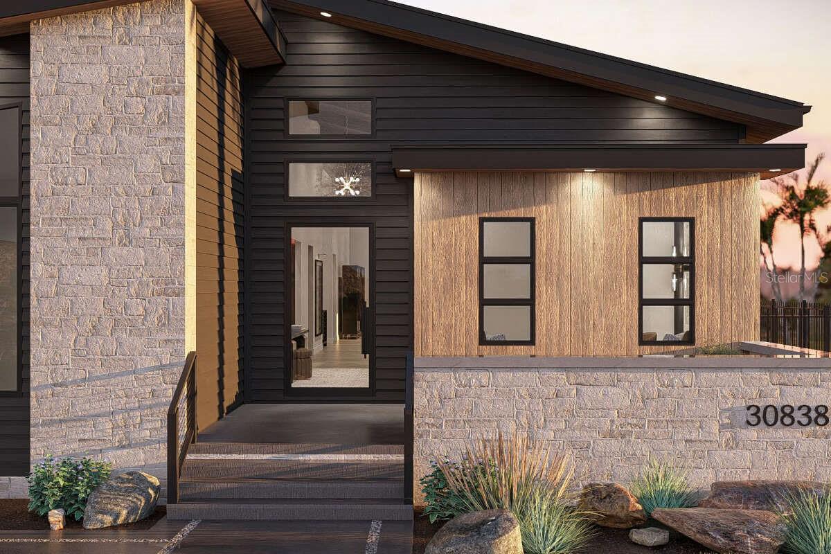 Pre-Construction. To be built. Modern 3-Bedroom Home with Office, Gourmet Kitchen, and 2-Car Garage. Experience modern luxury in this 3-bedroom, 2-bath home with a 2-car garage and private office. Bold architectural design, elegant finishes, and a thoughtful layout create the perfect balance of style and function. The inviting entryway with tall glass doors and clerestory windows leads into a bright open floor plan. The great room, dining area, and gourmet kitchen flow seamlessly together, featuring expansive windows, a dramatic stone fireplace, and warm wood details.
The kitchen is a showpiece, with custom cabinetry, a striking stone backsplash, built-in appliances, and a waterfall-edge island with seating. A bar/prep area adds convenience for entertaining, while a spacious pantry ensures plenty of storage. The private primary suite includes a designer accent wall, large walk-in closet, and spa-inspired bath with dual vanities, modern lighting, and a full-height tiled shower. Two additional bedrooms share a well-appointed bath, offering flexibility for family or guests.
A dedicated glass-enclosed office with built-in seating provides the perfect space for work or study. The mudroom with lockers and a laundry folding area add everyday convenience. Step outside to a covered porch and landscaped yard, ideal for relaxing or entertaining.
With its modern exterior design, luxury finishes, and functional split-bedroom floor plan, this home is a true showpiece built for today’s lifestyle. There’s so much more waiting to be discovered, so why wait? Make your dream of homeownership a reality by scheduling a tour today! Enjoy no CDD fees! Choose from various pool package options, and rest assured with great rated schools nearby. Conveniently located just 5 minutes to the Suncoast Parkway, 15 minutes to the airport, 20 minutes to downtown, and only 1.5 miles to Citrus Mall and 15 minutes to Tampa International Mall.