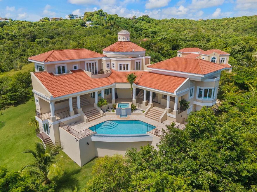 A Rare Investment & Lifestyle Opportunity in Palmas del Mar

Welcome to a one-of-a-kind Mediterranean estate, masterfully custom-built and tucked into the lush hills of Palmas del Mar, Puerto Rico’s resort community. This exceptional residence offers a unique blend of luxury living and investment potential, with breathtaking Caribbean views, privacy, and timeless elegance.

Featuring 5 spacious bedrooms, 3 full baths/ two half baths / luxurious bathrooms, and cathedral ceilings, this estate was designed with both comfort and sophistication in mind. The gourmet kitchen is a chef’s dream, while elegant finishes throughout the home elevate every detail. Seamless indoor-outdoor living extends to elite terraces perfect for entertaining, complete with an infinity pool and jacuzzi overlooking the ocean.

For lifestyle buyers, this is a private sanctuary offering world-class amenities, beach access, dining, golf, marina, and equestrian facilities—right at your doorstep. For investors, the property’s architectural appeal, location, and rental potential in a high-demand vacation market make it a standout income-producing asset.

Whether you’re seeking your dream home or a premier real estate investment, this extraordinary estate in Palmas del Mar delivers on every level—a true Caribbean gem like no other.
