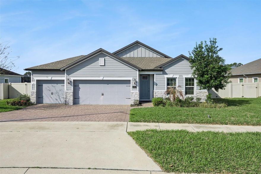 Welcome home! As you walk in, you’re immediately invited in by soaring vaulted ceilings that flow throughout the entire home, creating a bright and open feel. This well-maintained property features fresh interior paint and brand-new carpet in the bedroom and primary suite, offering a clean and move-in-ready experience.

The gourmet kitchen is a true showstopper, featuring quartz countertops, ample cabinetry, and a functional layout perfect for both everyday living and entertaining.

The primary suite provides a relaxing retreat with a large walk-in closet and dual sinks in the bathroom.

As you step outside and enjoy added privacy with a conservation lot—no rear neighbors and peaceful natural views with sunsets to die for. Also included is a custom outdoor kitchen by Paradise Grills, perfect for entertaining and enjoying Florida living year-round.

Additional upgrades include a whole-home water filtration system.

Located in a sought-after community surrounded by golf courses and scenic preserves, you’ll also appreciate easy access to major highways including 429, 408, and I-4, making commuting a breeze. Nearby, enjoy outdoor activities and walking trails along the western shore of Little Lake Harris.

This energy-efficient home combines comfort, style, and savings—don’t miss your opportunity to make it yours!