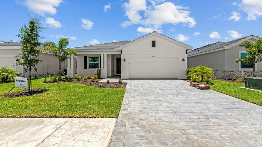 THIS HOME IS READY FOR YOU NOW!! Palm Lake at Coco Bay is a gated master-planned community with collections of new single- family homes in Englewood FL. Surrounded by beautiful streetscapes, all homesites will include a full lawn maintenance package for carefree living. Primely located, residents are in close proximity to water-borne adventures at Englewood Beach and Boca Grande. This single-story home features a split floorplan that divides the comfortable bedrooms with an open layout among the dining room, kitchen and family room. An attached lanai offers indoor-outdoor hosting opportunities, while the nearby owner’s suite showcases two walk-in closets. Prices and features may vary and are subject to change. Photos are for illustrative purposes only