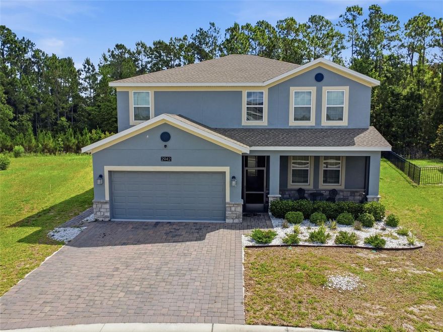 Located inside the sought after gated golf community of Providence, this rare Next Gen® home in Camden Park offers the perfect blend of space, flexibility, and multi generational living. Designed with convenience in mind, this unique floor plan features 4 bedrooms and 3 bathrooms in the main home, plus a private 1 bedroom, 1 bathroom attached suite complete with its own separate entrance, kitchen, living space, and laundry area, ideal for extended family, guests, aging parents, or added privacy.

Inside the main home, the entire first floor showcases durable tile flooring, while all bedrooms and the conveniently located upstairs laundry room provide everyday functionality. A screened front balcony adds additional outdoor living space and a charming place to relax.

Step outside to your own Florida retreat featuring a screened and pavered lanai with a 6-foot-deep saltwater pool overlooking peaceful conservation views, offering privacy with no rear neighbors. The paver driveway enhances curb appeal, while the home’s location within Camden Park, one of Providence’s solar communities, provides added energy efficiency benefits and potential utility savings.

Beyond the home, enjoy everything Providence Golf & Country Club has including two 24-hour manned gate, championship golf course, clubhouse, fitness center, resort style pools, playgrounds, tennis courts, walking trails, and more. Residents also benefit from a low HOA and no CDD fees.

Rarely do Next Gen® homes become available in Providence, especially with a private suite, saltwater pool, conservation views, and solar advantages. Whether you’re searching for space to accommodate multiple generations, frequent visitors, or simply extra flexibility, this home delivers a lifestyle that’s difficult to find.