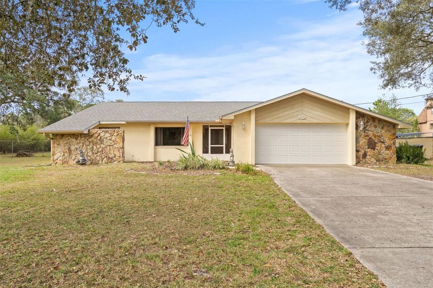 Don't miss out on this delightful 3-bedroom, 2-bathroom home that offers a relaxed and spacious lifestyle on a generous 1.1-acre lot, perfectly zoned for agricultural residential use. Inside this 1,805 square feet of living space you'll find three well-sized bedrooms designed with a split floor plan - ensuring privacy for family members and guests. Each bedroom provides ample closet space - with the master including a walk-in closet. The home features a roomy kitchen with an inviting eat-in space, a dedicated dining room, and a generously sized living area with French doors that open to the screened-in pool area. The pool area has plenty of space to entertain and is complete with charming brick pavers. This is an ideal spot for pool parties, relaxation, and outdoor dining. Outside the screened-in lanai, the property is fully fenced, providing privacy and security. You'll also find two storage sheds (one with electric available) and a substantial  20' x 40' outbuilding with 2 mini-split AC units and electric, currently set up as a dog kennel. However, it can easily transform into a man cave, workshop, or in-law suite. The options are endless! The garage is fully functional and includes a mini-split unit, offering both extra storage space and the option to keep your cars sheltered. For RV enthusiasts, the property comes with a convenient 50 amp RV hookup and space for parking on the front right side of the home. The convenient location on the southside of Spring Hill offers a faster commute to Tampa, Tampa International Airport, and the southern beaches. The property is just 7 minutes to the Suncoast Parkway. Nearby conveniences within 5 minutes include healthcare offices, Bravera Health Hospital, Publix, the YMCA, and options for dining! Roof and water heater replaced in 2021!