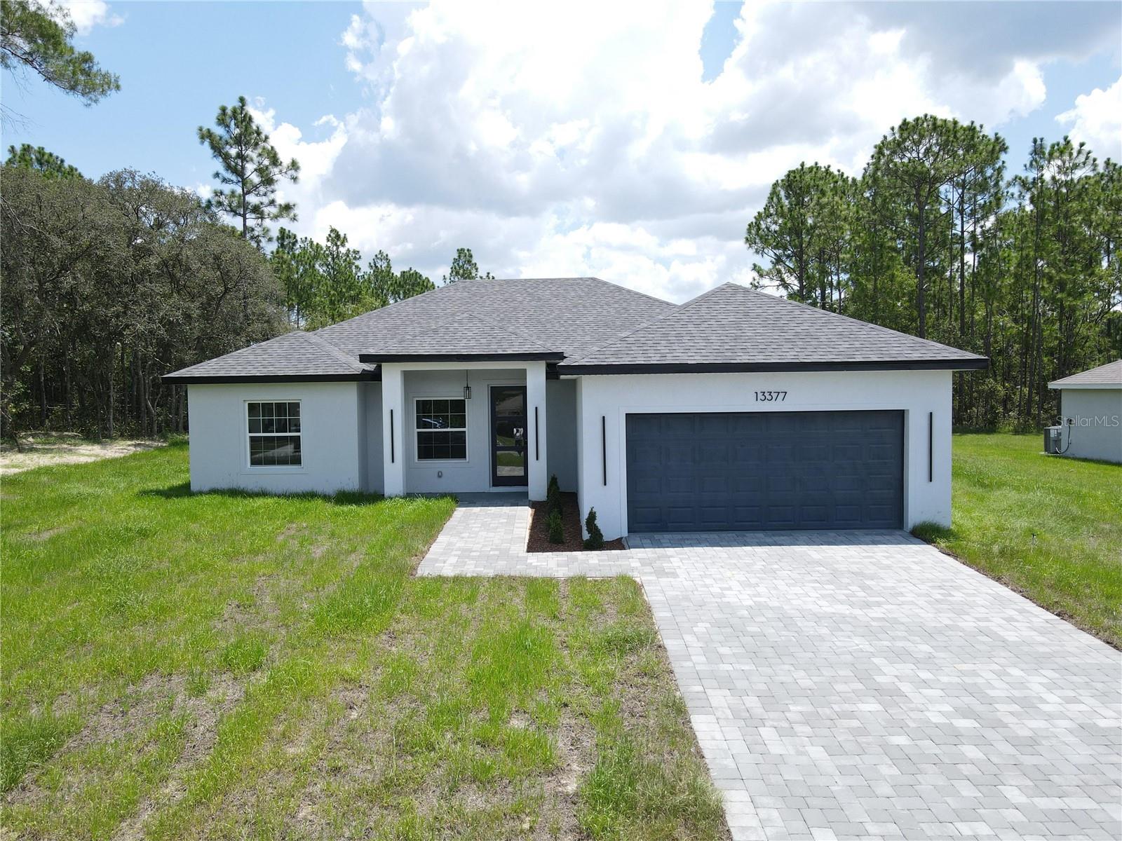 One or more photo(s) has been virtually staged. Move-In Ready New Construction Home in Ocala – Perfect for Living or Investment!
Step into this stunning brand-new construction home located in the heart of Ocala, Florida. This move-in ready property is the perfect opportunity for families seeking comfort and style, or savvy investors looking for a high-demand rental home in a growing market.
Featuring four spacious bedrooms and two full bathrooms, this thoughtfully designed residence offers plenty of space for family living, entertaining, or hosting guests. The open floorplan layout creates a seamless flow between the modern, oversized kitchen, dining area, and living room—ideal for today’s lifestyle.
The kitchen is a true showstopper, boasting solid wood cabinets, stone countertops, and high-end appliances including a range, refrigerator, microwave, and dishwasher. Whether you're preparing a family dinner or entertaining guests, this kitchen provides both function and elegance.
Large sliding glass doors flood the home with natural light and lead to the backyard, offering the perfect setup for indoor-outdoor living. The home includes a dedicated dining room, a welcoming living room, and a 2-car attached garage with ample storage space.
Don’t miss your chance to own this beautifully finished home in one of Ocala’s desirable neighborhoods. Whether you're buying to live or invest, this property delivers exceptional value, comfort, and quality. Schedule your tour today and make this house your new home or next income-generating asset.