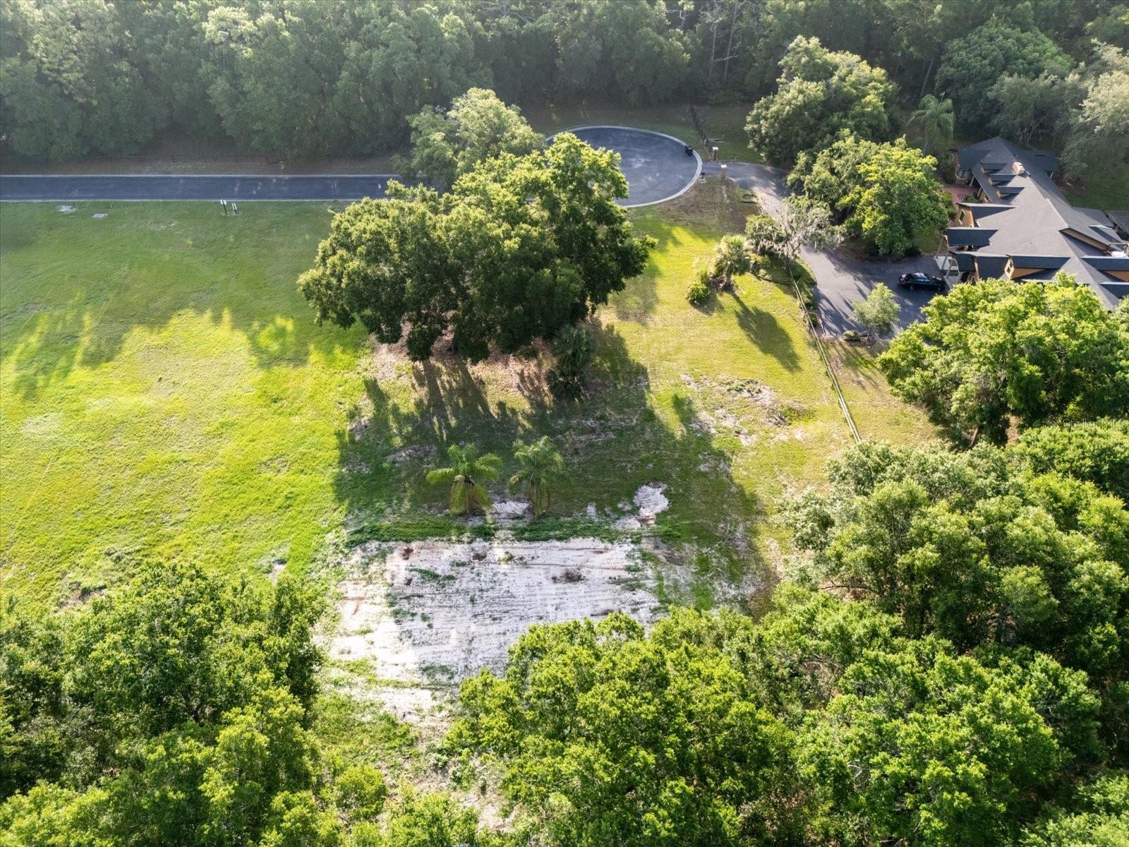 ONE ACRE CUSTOM HOME-SITE Visit Matera today, the first new custom home has begun! Schedule a meeting with the Builder! Matera – Gated Luxury living in Seminole County. One of only a few remaining places in Seminole County to build your new CUSTOM HOME. One acre home sites are hard to find. Matera offers one acre home sites, gated with County water and natural gas available to each home. Plus you can build your In Law Suite/ADU up to a max of 1000 SF, with a kitchen for the In Laws or Guests.
Build your dream home in a pristine gated community focused on luxury-living in peace and harmony. This small, private, community in Seminole County now has new owners. New custom homes are built exclusively by award-winning home builder Tolaris Homes. Only (3) one-acre home sites are remaining. Homes start at $1.2 Million with a minimum of 3,400 sq. ft. living required. Respectful and private housing of a boat, RV, and/or bus is permitted.
Matera is in close proximity to numerous hospitals in Lake, Volusia, Seminole and Orange County with easy access to the brand new Orlando Loop (SR 417/529), Disney World as well as THREE airports: Sanford Orlando International (SFB), Orlando International (MCO), and Daytona Beach International Airport (DAB). Matera is also a short drive to Historic Downtown Sanford and DeLand, both of which are filled with dining, shopping, history, lakes, and scenic walks. Excellent schools.Please call for more details.
*Home construction must begin within 6 months of the home site closing.
