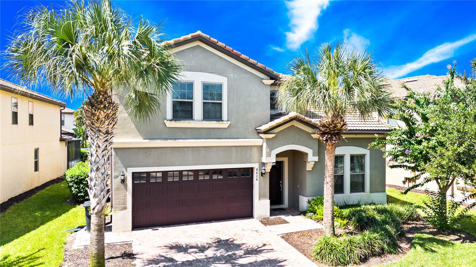 This fully furnished 8-bedroom, 6-bathroom home offers over 4,000 sq. ft. of living space and is ideal for large families, second-home buyers, or investors seeking a high-occupancy rental property. Featuring three master ensuites—one on the first floor and two upstairs—this home provides exceptional comfort and privacy for multiple guests.
Enjoy your own private pool and spa, surrounded by a pavered deck and a large covered lanai—perfect for outdoor dining and relaxation. The property is located within walking distance to the community clubhouse, resort-style pool, playground, and other amenities.
Inside, there is no carpet anywhere—LVP flooring in all bedrooms and the upstairs loft, with tile flooring throughout the main living areas. The spacious kitchen features white colored shaker cabinets, granite countertops, a modern backsplash, and a large center island with ample seating. The open floor plan includes a formal dining area and a living room with pool views.
The primary suite downstairs is oversized with two walk-in closets and a luxurious ensuite bathroom featuring a soaking tub, glass-enclosed walk-in shower, dual vanities with granite countertops, and direct access to the pool deck. A second bedroom downstairs is conveniently located next to a full bathroom with a walk-in shower.
Upstairs, the large loft functions as a second living area or game room, complete with a pool table and air hockey. Two additional master suites upstairs include spacious bathrooms with dual vanities and walk-in showers. All bedrooms are tastefully furnished and decorated, making this home move-in or rental ready.
Additional features include a tile roof, pavered driveway, custom drapery, and quality furnishings. There is also a unique opportunity to purchase the neighboring home (8820 & 8824 Rhodes) for side-by-side ownership.
Contact us today to schedule your private showing and experience all this exceptional property has to offer.