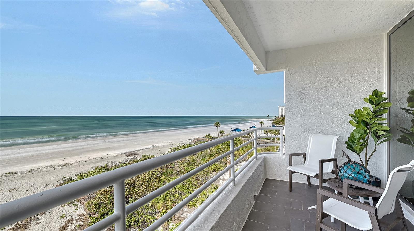 Welcome to your dream oasis. Just completed fully updated, turnkey furnished unit, directly on the Gulf, at Sunset Beach. This stunning retreat boasts spectacular renovations, featuring a custom kitchen with solid wood cabinets, a light commercial-grade hood fan and elegant quartz countertops throughout. The kitchen has a GE Monogram induction stove with a convection oven, a GE Monogram refrigerator and dishwasher, and a Sharp microwave drawer. You can experience the conveniently located laundry room with a Speed Queen washer and dryer. Endless Tankless Tempra hot water system, bar fridge, and a new air conditioning unit. Both baths are equipped with Hansgrohe water fixtures and Kohler electric toilets. A complete trim package, including crown molding and solid core doors, enhances the finishings. Enjoy the seamless beauty of porcelain tile flooring throughout, complemented by a newer impact front door, high-impact windows, and patio slider. Additional features include remote-controlled window shades and fans. Exterior enhancements grace the common hallways with new ceramic tile. Sunset Beach, a small gated community on southern Longboat Key, features three mid-sized buildings south of Publix and CVS. You’ll find yourself close to a public library, tennis courts, banks, places of worship, restaurants, and Town Hall. Embrace the lifestyle just minutes from world-renowned St. Armand's Circle and Sarasota, where endless adventures await.