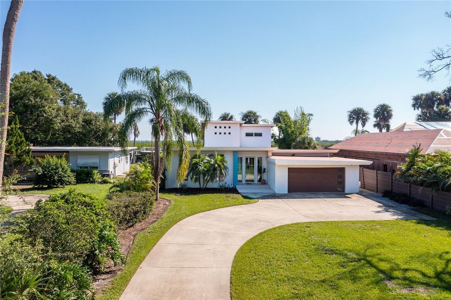 Welcome to 705 Faulkner St, located in the heart of the Historic Arts District in New Smyrna Beach. Step into a gallery of awe-inspiring views and experience the epitome of luxury living. This exquisite mid-century modern home offers unparalleled intercoastal access and boasts 84' of pristine river frontage, complete with a boat house and 10,000lb lift. ( additional floating dock for kayak launch)
The home features three generously sized bedrooms, each with its own unique charm and En-suite bath.
An additional half bath and dedicated office provide ample space and privacy for family and guests.
Striking Design, meticulously renovated to maintain mid-century modern elegance, the home seamlessly blends classic architecture with contemporary upgrades, creating a timeless yet modern aesthetic. The kitchen is a chef's dream, outfitted with top-of-the-line appliances from Gaggenau, Miele, Sub-Zero, and True. Custom cabinetry, reminiscent of high-end yacht interiors, is paired with the sophistication and folly of Sasso & Blum hardware, for a touch of maritime luxury. The Artistic Interior has custom built- in furnishings which complements a minimalistic lifestyle. The unique ambiance of a feature wall created by reclaimed Florida hickory, brings natural beauty and warmth into the living space. Panoramic Views from the custom Euro-wall sliding doors provide unobstructed views of the intercoastal waters, enhancing the connection between indoor and outdoor living.
The elegant outdoor living spaces pull together the beautifully landscaped outdoors, highlighting features of Italian porcelain pavers, an outdoor kitchen with granite countertops, and multiple lounging and alfresco dining spaces, perfect for entertaining or relaxing.
The luxurious Pool and Spa with an infinity-edge, heated & saltwater, are designed for ultimate relaxation, complete with lighted bubblers, framed outdoor mote and a striking waterfall wall feature renders you silent just basking in your private luxury resort. Located just five minutes from the beach and within walking distance to the vibrant Canal Street Historic Arts District, this property combines the convenience of coastal metropolitan living with the tranquility and spoils of waterfront ventures. Book your private showing today!