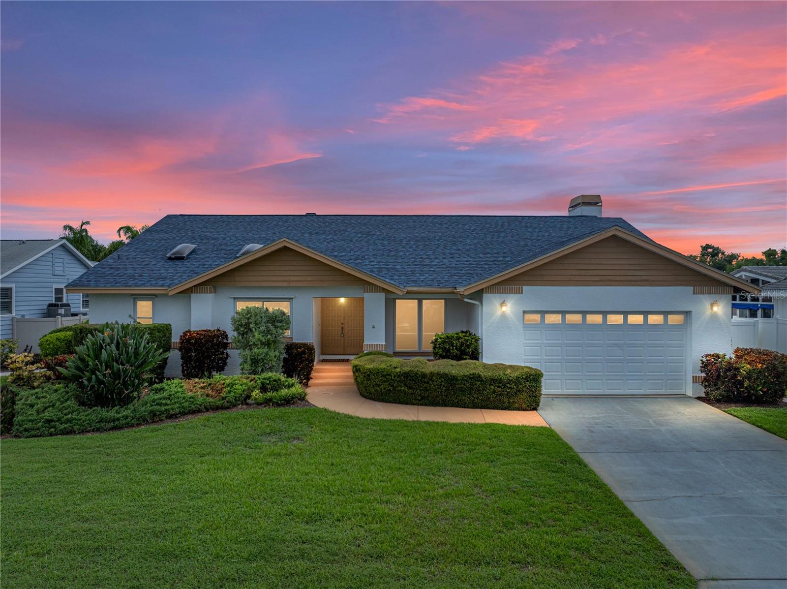 Welcome to the 'House that Love Built!' This custom-built, one-owner home has been cherished since day one, as its condition certainly confirms. Purchased pre-construction as a 25th anniversary gift to each other, this home has served as a beloved second home and vacation retreat for family and friends since 1987. You and yours will love the peace of mind this solid, all-block home on slab construction delivers. A new roof was installed in 2023 and new impact windows and sliders were installed in 2006. Per the survey, the home sits at 10 & 11ft above base flood elevation, which is yet another very desirable attribute contributing to safety, resilience, & insurance discounts. Situated on a generous 1/4-acre lot, a relative rarity for homes of this era & size on the beautiful island of Tierra Verde, the property features a lushly landscaped backyard oasis with flowering trees, bushes, and greenery all within the perimeter of a vinyl privacy fence. At the heart of this enormous and well-conceived backyard is a sparkling pool — perfect for relaxing and entertaining. You may access the backyard from the Florida-room or the primary suite. Inside the home, you will find a desirable split-bedroom layout, soaring ceilings, and an open-concept kitchen designed to bring family and friends together. An expansive Florida room with a wall of glass doors stretches across the back of the house providing a beautiful view that brings the beauty of the outdoor oasis into the home itself! The primary bedroom has soaring ceilings and an ultra-spacious ensuite bathroom which enjoys both a walk-in shower with frameless shower enclosure and a separate soaking tub. There is also a large double vanity, thoughtfully designed with a seated area between the sinks for comfortably drying your hair, applying makeup, or putting on your best Jimmy Choos! Here too there is closet space galore and an abundance of natural light gracing the room! The other two bedrooms are conveniently located at the opposite/south end of the home offering owners and guests alike privacy. Originally planned as a four-bedroom home, there is a multi-purpose area off of the living room, which is perfect for an office or perhaps a music room or artist’s studio. Or should you require a 4th bedroom, now, or in the future... that too is an option. FYI: Full-size original plans are onsite. The open-plan kitchen features custom-built solid wood cabinetry, including some amazing features that will wow you with their thoughtful creativity and practicality! As the kitchen area seamless flows into the great room area - as well as 'spills' into the backyard area, it is easy to imagine beautiful sunny days filled with friends and loved ones enjoying the best Florida has to offer, right here in one of its finest gems: The beautiful oasis of Tierra Verde, which is located between two of the highest-rated beaches in the nation, Ft. DeSoto Park and St.Pete Beach. Within walking distance, or a short drive or bike ride, there are many restaurants to enjoy, as well as great live music at The Island Grill or at the rooftop bar/restaurant at The Residence Inn. There are two marinas within walking distance, which will excite boaters who would like a boat, but prefer the convenience of just dropping it off at the marina, where it is cleaned, fueled, and then safely stored! Life is Good... Life like this is even better. Get your sun and fun on and then come home to your retreat in 'The House That Love Built!'