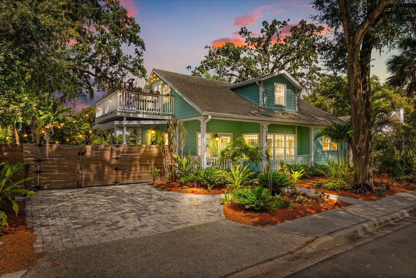 Welcome to 748 Altaloma Avenue, Orlando, FL 32803, a captivating residence that embodies the quintessential Key West Bungalow charm while offering modern amenities and a vibrant lifestyle. Built in 1996, this two-story home harmonizes tropical aesthetics with contemporary comforts, located in the heart of Colonial Town and within walking distance to Orlando's acclaimed restaurants, eclectic bars, and coffee spots.
This delightful home features 3 bedrooms and 2.5 bathrooms, thoughtfully designed for both privacy and entertainment. The master suite, conveniently situated on the first floor, boasts a walk-in closet, an updated bathroom, and elegant French doors that open to the lush backyard, creating a seamless indoor-outdoor living experience. The galley-style kitchen is a chef's dream, equipped with stainless steel appliances, including a newer refrigerator, and accentuated by vaulted ceilings that enhance the space. Bathed in natural light from expansive windows, the interior exudes warmth and welcomes the Florida sunshine in every room. The second floor hosts two additional bedrooms, a full bathroom, and a cozy office/reading nook. One of the upstairs bedrooms offers French doors leading to a charming balcony, perfect for sipping morning coffee or enjoying a relaxing evening wine, while overlooking the vibrant neighborhood scenery. The outdoor space is a true entertainer’s paradise, featuring a completely paved area with a concrete outdoor kitchen and bar-style seating. The property is adorned with lush landscaping, further enhancing its tropical flair. A new water heater and air conditioner were installed in 2025, and a brand-new roof will be added before closing, ensuring a worry-free living experience. The home's exterior invites you to unwind on the front porch swing, soaking in the serene surroundings. Additionally, it is zoned for the coveted Audubon Park K-8 school and offers walkability to Lake Highland, making it an ideal choice for families seeking educational excellence.
Experience the perfect blend of serene tropical living and vibrant city life at 748 Altaloma Avenue, where your dream home awaits.