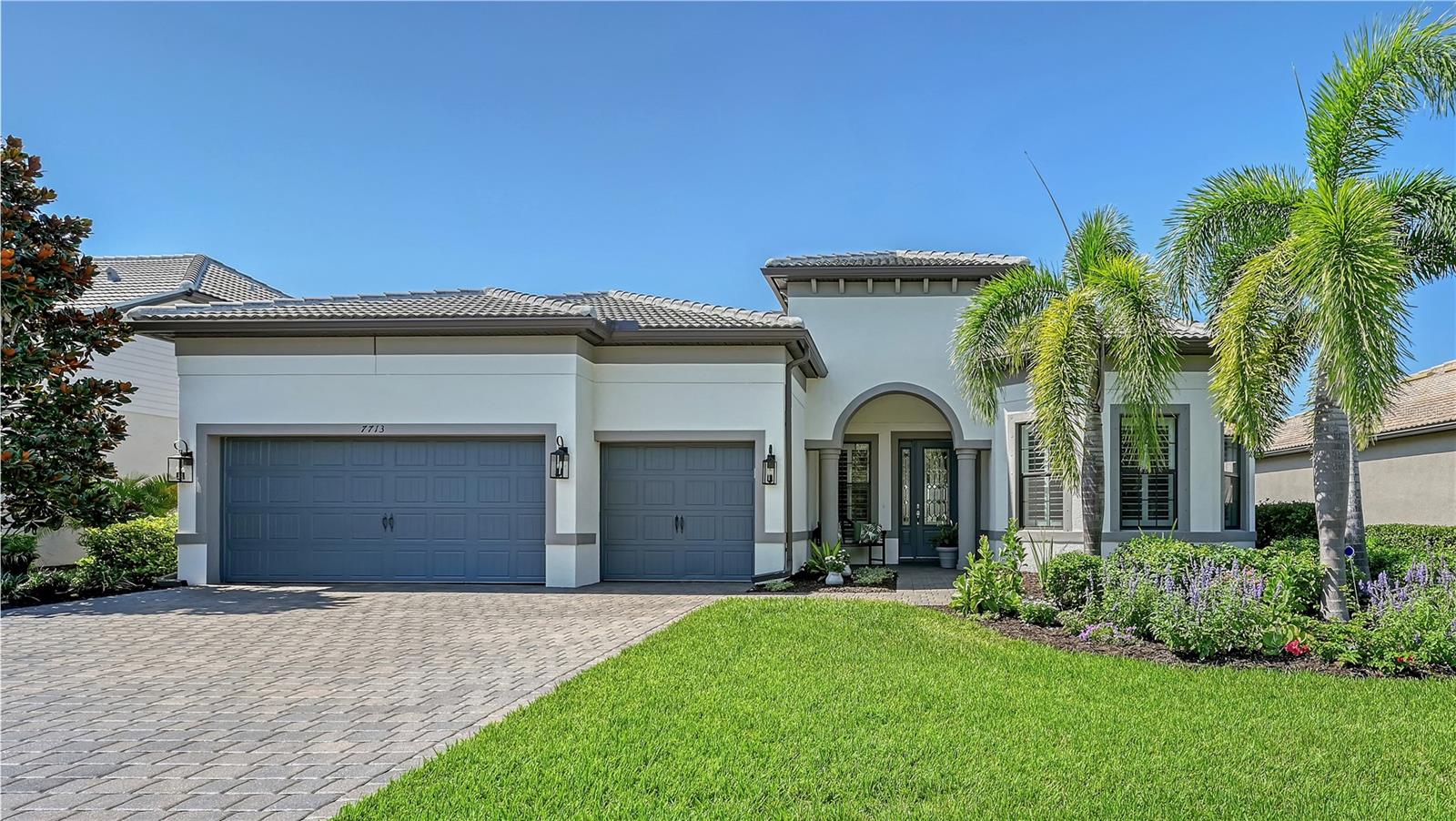 Step into elegance with this stunning 3-bedroom, 3-bath home, featuring soaring 12-foot ceilings, extensive wood detailing, and a fireplace that adds warmth and sophistication. The expansive, open floor plan, with its zero-corner sliders, seamlessly blends indoor and outdoor living.
The gourmet kitchen is a chef’s dream, boasting a massive quartz island, stainless steel Kitchen Aid appliances, a 5-burner gas cooktop, and a walk-in pantry. Dine in or enjoy an alfresco culinary experience outside on your screened-in lanai with an outdoor kitchen overlooking the peaceful lake. A dedicated office/den offers flexible space for work or relaxation. The oversized 2-car garage includes epoxy flooring, overhead storage, and ample space for your golf cart. Lawn maintenance is included, so you can spend more time enjoying the incredible amenities that Shoreview has to offer. Savor the resort-style pool & spa, the indoor gathering room, or the outdoor bar, firepits, and barbeques. Work up a sweat in the state-of-the-art fitness center or lighted tennis and pickleball courts. Your four-legged friend will love the dog park. There is an active social calendar with interest groups for bridge, bunco, Euchre, book club, Mahjong, yoga, water aerobics and more. Waterside Place is just minutes away with restaurants, shops, sand volleyball, and a children's splash park. You won’t want to miss Food Truck Wednesday nights or the Farmers Market on Sunday mornings. Siesta Key and Lido Beaches are just a short drive away. This home offers the perfect blend of luxury, comfort, and an active lifestyle in a prime location. Lakewood Ranch has been named the #1 multi-generational community in the nation. Whether you're seeking tranquility or connection, this home offers the perfect blend of luxury, comfort, and community. Come live where every day feels like a vacation.