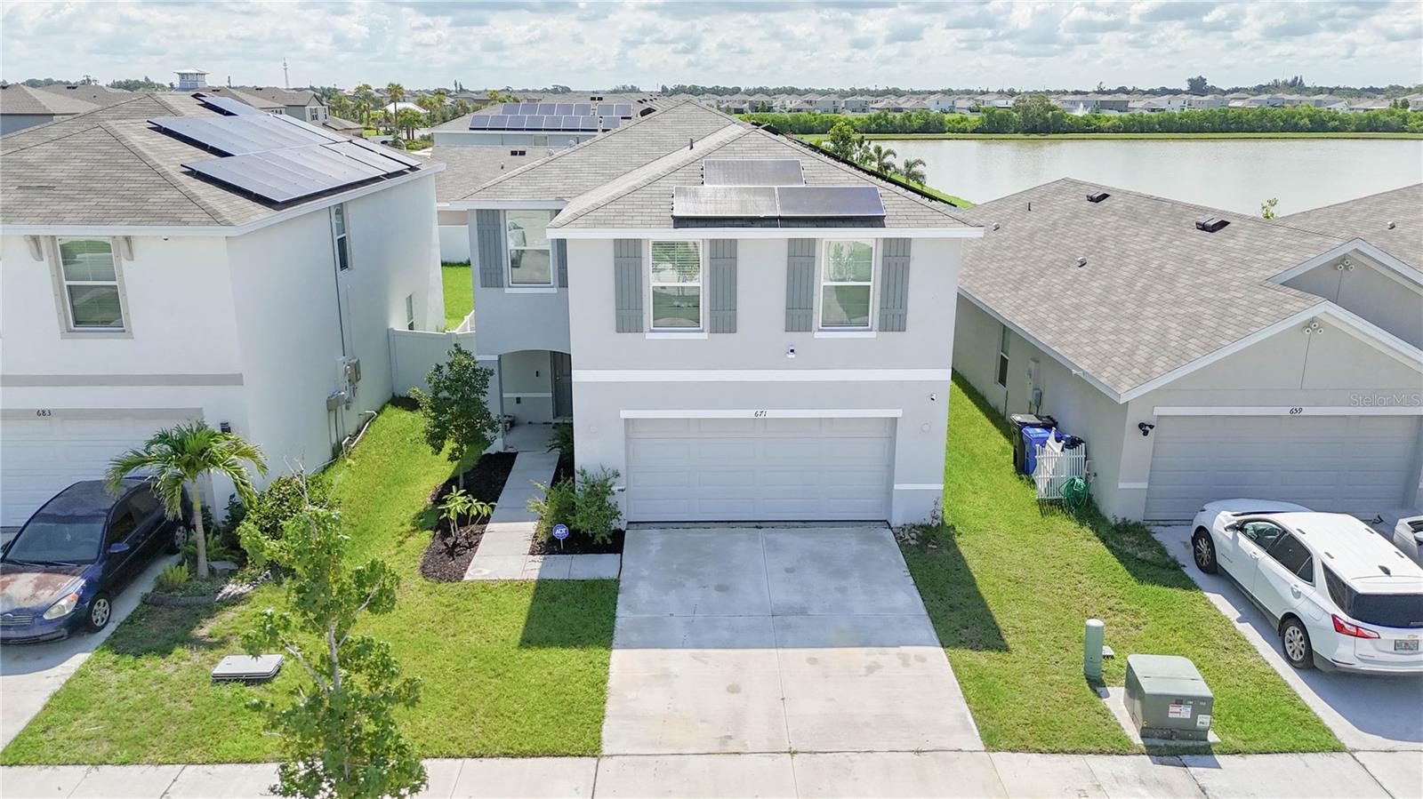 This newly listed two-story home in Ruskin offers 4 bedrooms and 3 bathrooms across 2,078 square feet of well-designed living space. Built in
2021, this modern home features high ceilings that create an open, airy feel throughout. The kitchen is equipped with granite countertops and
stainless steel appliances, making it both functional and stylish. The main living areas showcase tile flooring, while the bedrooms are carpeted for comfort. The primary bedroom provides a spacious retreat with plenty of natural light. Outside, you'll find a fenced yard that's perfect for privacy and relaxation. The home comes with solar panels that can either transfer to the new owner or be removed before closing. Additional features include a water softener and a 1-year home warranty for peace of mind. The Shell Cove community offers great amenities including a pool, tennis courts, and playground - all just steps from your door. The Shell Cove Club House is located nearby at 1155 7th Avenue Northwest, providing additional recreational opportunities. This location puts you close to everything you need. Family Dollar on North U.S. Highway 41 handles your shopping needs, while Ruskin Christian School on College Avenue West serves the educational community. The area offers easy access to restaurants, theme parks, major roads, and the airport. Whether you're looking for a family home or a great investment, this property combines modern features with community amenities in a location that connects you to all that Ruskin and the greater Tampa Bay area have to offer.