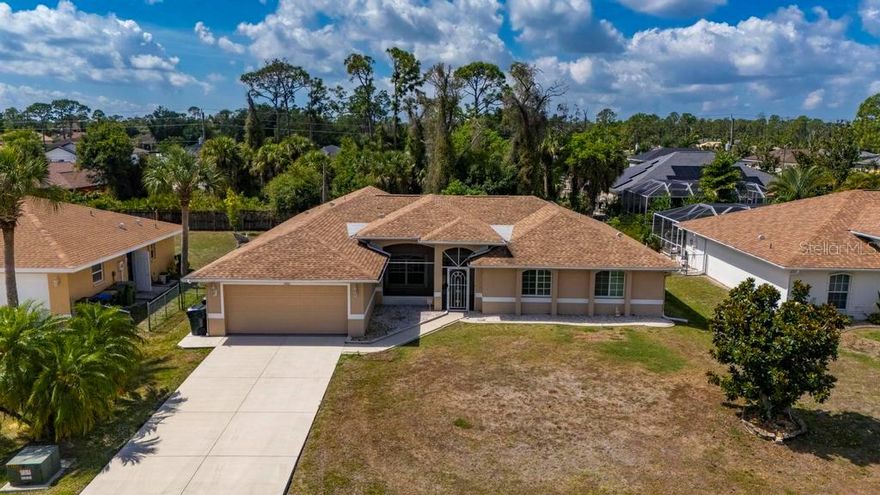 Welcome home to this beautifully maintained 3/2/2 pool home nestled in the heart of North Port! From the moment you walk in, you'll be impressed by the thoughtful layout featuring a great room / living room, separate dining area, and a spacious breakfast nook — perfect for both everyday living and entertaining. The true chef's kitchen is a showstopper, boasting a stunning 10-foot island, rich wood cabinetry, gleaming granite countertops, stainless steel appliances, a beverage fridge, and abundant storage for the home cook who demands it all.
The split bedroom floor plan offers privacy and space, with generously sized bedrooms and well-appointed bathrooms. The washer and dryer are included — with a brand new washer — making this home truly move-in ready!
Step outside to your own private oasis — a sparkling pool newly resurfaced with Pebble Tec, complemented by a beautiful paver deck, new pool heater/chiller, and a screened cage, making year-round Florida living effortless. The fully fenced yard offers privacy and plenty of room for pets, play, or simply relaxing in your own slice of paradise.
Major updates give you peace of mind: new roof (2021), hurricane shutters throughout, and a handy shed for additional storage. Located in Flood Zone X — no flood insurance required!
Close to shopping, dining, schools, and all that North Port has to offer. This one checks every box — schedule your private showing today!
