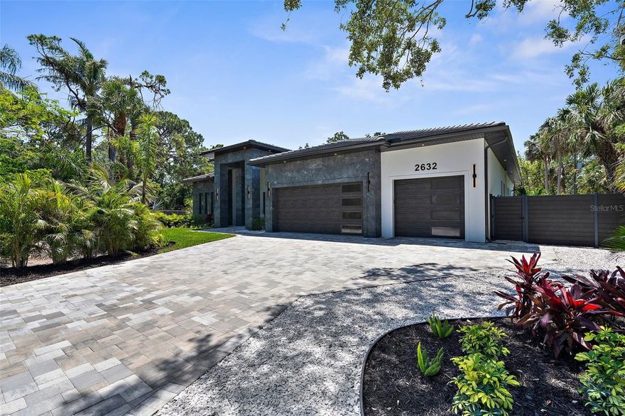 Wow! This one-of-a-kind luxury residence is truly a rare gem—an opportunity you won’t find again in Sarasota. Perfectly positioned at the very end of a quiet street, this home sits on a rare oversized 14,200 SqFt lot, offering ultimate privacy and a serene setting. Step outside and you’re welcomed by your own private oasis: a beautifully landscaped, fully fenced backyard with a saltwater heated pool, spa, waterfall, and marble-tiled lanai complete with an outdoor kitchen, shower, and pool bath—perfect for entertaining or unwinding in total peace. The oversized pivot front door makes a bold first impression, setting the tone for the elegant design throughout.

Inside, you’ll find 5 bedrooms, 4.5 bathrooms, and a spacious 3,543 SqFt under air (4,957 total). Every detail has been thoughtfully crafted—from custom cabinets and closets to solid wood doors, level 5 smooth drywall, and soaring ceilings ranging from 12 to 16 feet. This home features hurricane-impact windows and doors, two A/C units, spray foam insulation, low-voltage wiring, LED lighting, and indoor/outdoor speakers. The chef’s kitchen is a true highlight with Thermador appliances, walk-in pantry, quartz countertops, and two wine coolers—perfect for everyday living and entertaining.

Tucked away in the heart of Sarasota’s highly sought-after and fast-growing Arlington Park neighborhood, this property offers a rare combination of privacy and convenience. Just minutes from downtown, you’re steps from the charm of Arlington Park—featuring a 50-meter lap pool, 25-yard instructional pool, basketball and tennis courts, playground, outdoor gym, a scenic walking trail, dog park, and more. It’s also home to the renowned Tsunami Swim Team, offering programs for swimmers of all ages.

This property is truly a masterpiece—designed with quality, elegance, and lifestyle in mind. Homes like this are exceptionally rare. Don’t miss your chance to own this Sarasota gem. Schedule your private showing today!