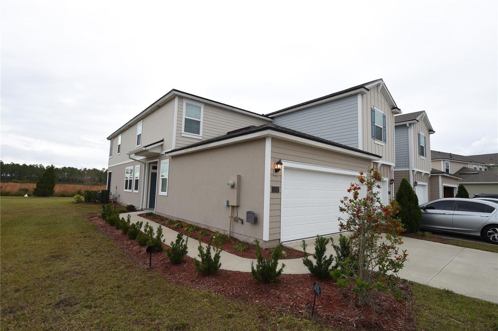 Photo of 207 Redbud Road, Palm Coast, FL 32137 (MLS # FC315707)