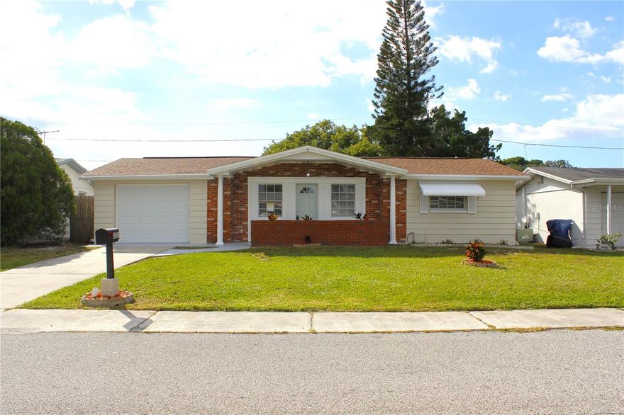 UPDATED BRIGHT HOME, WITH 3BR/1 BATH/1 CAR GARAGE. An excellent location in a well-established family neighborhood, Beacon Square. As you approach the home, you will see the porch leading you to an elegant front door. Step into the house and see a generous living room, a perfect space for gatherings and entertaining guests. To your front is the beautiful kitchen with new cabinets, modern granite-imitation Formica countertops and new backsplash. New stainless steel appliances (refrigerator, range, and microwave to be installed on the 23rd) and an open dining room area next to the kitchen for delightful meals and celebrations. From the entrance to your right is the master bedroom, the updated bathroom with new vanity and toilet, next to it the second bedroom. From the entrance to your front is the dining room and after it the third room, that can be used as a family room, office, or bonus room! That gives you access to the beautiful lanai—an ideal retreat just waiting for you with access to your wood-fenced green backyard. The house has new vinyl flooring and new floor moldings throughout. There are some new double-pane windows and new 6-panel doors. Recently painted interior and exterior... And much more! ROOF JUST INSTALLED IN 2025, AC SYSTEM 2019, NEW GARAGE DOOR JUST INSTALLED, NEWER WATER HEATER, PUBLIC SEWER, NO HOA, NO CDD, NO FLOOD INSURANCE REQUIRED!! Come see it before it gets under contract!!