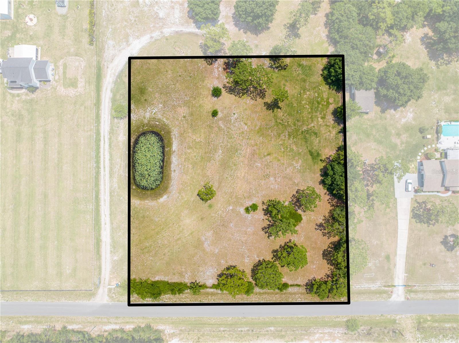 Looking for land that’s flat-out perfect? This 2.05-acre beauty checks all the boxes — and then some. With 295x305 dimensions, it’s a clean, square canvas ready for your dream home, barndominium, or custom estate. No weird shapes. No wasted space. Just solid ground and solid potential.Enjoy a full impact fee credit (a $40,000 value!), meaning you're already ahead before the first shovel hits the dirt. Add in a small scenic pond, a paved county-maintained road, and Flood Zone X peace of mind — and you’ve got one of the most build-ready lots on the market.Located in a growing area with room to breathe and no HOA breathing down your neck, this parcel is the kind of rare find that gives you flexibility and future value