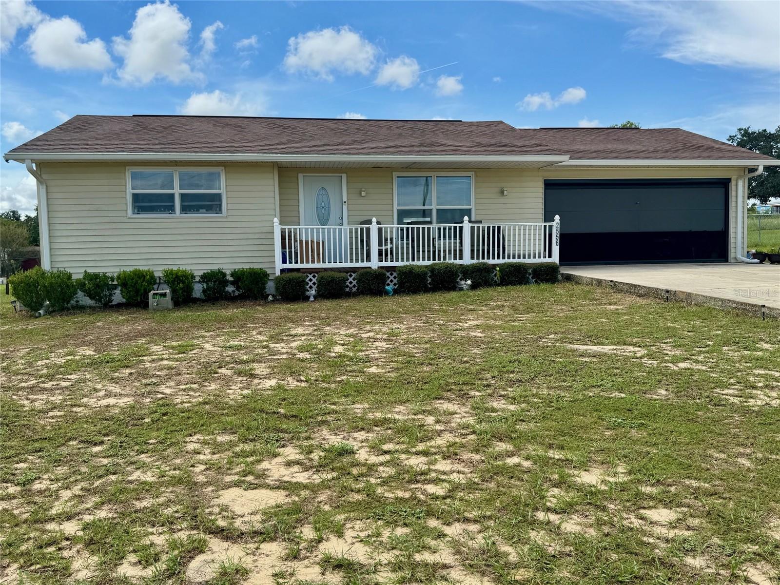 This most attractive home sits on almost 3/4 of an acre and is completely fenced front and back. The inside of the home has been lovingly cared for and has about $20,000. worth of upgrades. Some of the upgrades include new flooring, new hurricane strength windows in the Florida room, a new front door and a remote controlled screen that rolls up and down for the garage door. The roof was replaced in 2017 and the water heater in 2024. The owner also added an outdoor shower for those hot summer days of mowing the grass. The kitchen has really nice kitchen cabinetry and the Florida room is bright and cheerful with at least 8 windows and a side door exit. There is also a half bath in the garage and the shelving and upper rack stays. There is a solar system on the home with a low monthly payment to be assumed by a new buyer. Attractions that are close to this home are the Bok Tower Gardens, The Lake Wales History Museum, recreation opportunities at Tiger Creek Preserve and the large western-themed ranch resort, Westgate River Ranch Resort. There is also Lake Kissimmee State Park. You are also only about 32 miles from Walt Disney World. Make your appointment today