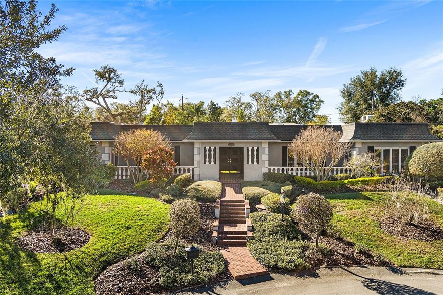 Enjoy worry-free living and elevated entertaining in this French-inspired estate, featuring a whole-home generator and a completely remodeled, show-stopping Chef's Kitchen —perfectly suited for Florida living. Tucked away on a quiet cul-de-sac in the highly desirable Scott Lake area, this exceptional residence offers deeded lake access and scenic lake views from select areas of the home, blending privacy, elegance, and lifestyle.

A stately brick walkway, lush landscaping, and classic brick terraces create a striking first impression. Through grand double doors, the home reveals a refined showcase of craftsmanship with plantation shutters, custom millwork, and architectural detail throughout. This thoughtfully designed 4-bedroom, 3.5-bath residence balances timeless character with modern upgrades.

The marble-tiled foyer with grasscloth wallpaper sets a rich, welcoming tone, leading to a charming step-down entertaining space and formal dining room accented by leaded-glass windows. Brazilian cherry hardwood floors, crown molding, and soft neutral tones enhance the open-concept living areas, all anchored by the fully remodeled chef’s kitchen. Designed for both daily enjoyment and elevated entertaining, the kitchen features an oversized quartz waterfall island, two-tone custom cabinetry, and a concealed custom pantry, complemented by a curated suite of premium appliances by Sub-Zero, Thermador, Bosch, and Rangemaster. A butler’s pantry with a second Sub-Zero refrigerator further enhances functionality and hosting ease.

The primary suite offers a peaceful retreat with serene lake views, a spacious walk-in closet, and a beautifully updated spa-style bath. Additional bedrooms include en-suite bathrooms, while a flexible fourth bedroom is ideal for guests or a home office.

Outdoor living truly shines on the screen-enclosed swimming pool and lanai, providing a private, low-maintenance setting ideal for year-round enjoyment and entertaining, while enjoying fresh fruit from Papaya, Avocado, and Lemon trees.  The sparkling heated saltwater pool creates a tranquil retreat for relaxing or hosting in comfort and privacy. With two new A/C units and the whole-home generator, this home delivers confidence, comfort, and peace of mind in every season.

Homes of this caliber—offering architectural character, modern systems, and deeded lake access in such a private setting—are seldom available. This is a home that must be experienced in person. Schedule your private showing today and discover the lifestyle this Scott Lake estate provides.