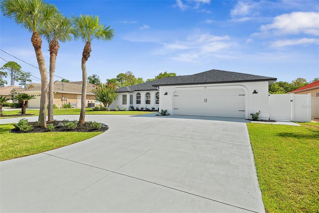 Photo of 34 Woodhollow Lane, Palm Coast, FL 32164 (MLS # FC321672)