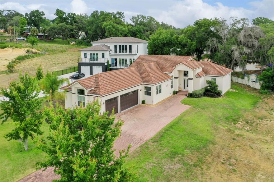 Tucked away in the intimate gated community of The Moorings, this exceptional residence offers a rare opportunity to enjoy luxury living on Lake Minnehaha, part of the renowned Clermont Chain of Lakes. With just 14 homesites on a quiet cul-de-sac, The Moorings provides a private and peaceful setting just minutes from shopping, dining, top-rated schools, and charming downtown Clermont.

Designed for both everyday living and effortless entertaining, the home features three spacious bedrooms, each with its own en suite bathroom. The stunning chef’s kitchen is truly the heart of the home, showcasing an oversized island, abundant cabinetry, a gas cooktop, and an open layout that flows seamlessly into the main living and dining areas. 

The property includes a reserved location for a future boat slip adjacent to the community boathouse, offering the opportunity to embrace the boating lifestyle on the Clermont Chain of Lakes. The community boathouse features a full kitchen and gathering area, making it the perfect place to relax, entertain, and take in spectacular sunset views over Lake Minnehaha.

Whether you are seeking a full-time residence or a luxurious retreat, this remarkable home combines sophisticated design, modern conveniences, and an exceptional waterfront lifestyle.