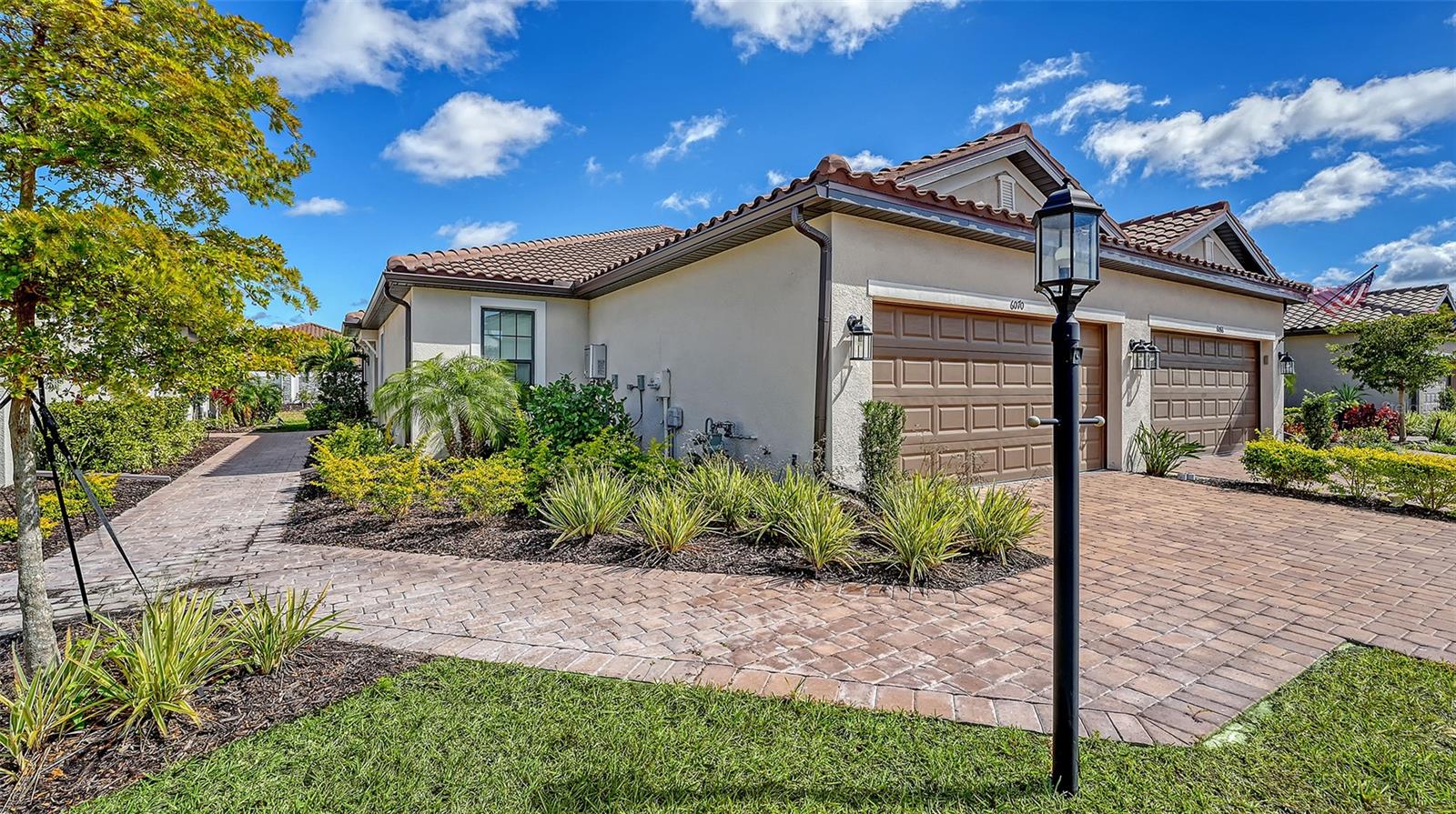 Exquisite Twin Villa in Esplanade at The Heights – Resort-Style Living at Its Finest! Welcome to the Ibis, a stunning Twin Villa home that blends elegance, functionality, and resort-style living in the heart of Bradenton, Florida. With 1,533 square feet of thoughtfully designed living space, this barely-lived-in, like-new home offers 2 bedrooms, 2 baths, a versatile study, and a spacious 2-car garage with an epoxy floor. Step inside and be captivated by the open-concept design, where the gourmet kitchen seamlessly connects to the great room and dining area, creating the perfect space for entertaining or relaxing. The kitchen is a chef’s dream, featuring upgraded appliances, ample cabinetry, beautiful quartz countertops, and a large bar counter for extra seating. Whether hosting a dinner party or enjoying a quiet meal, this space is sure to impress! The primary suite is a private oasis, boasting a spa-like en suite bath with gorgeous quartz countertops, dual sinks, stunning tilework, and an expansive walk-in closet. A second large bedroom offers comfort for guests, while the versatile study can easily transform into a home office, hobby room, or even a third bedroom. Enjoy Florida living at its best with an extended screened-in patio with elegant pavers, perfect for morning coffee or evening gatherings. A gas line for your grill makes outdoor entertaining a breeze! Additional upgrades include a Cali top in the kitchen, double pocket doors in the study, a 15-amp floor outlet, a pre-plumb for a future laundry sink, and a charming garden fence wall. Esplanade at The Heights is more than just a community – it’s a lifestyle! This gated, maintenance-free community offers an array of resort-style amenities, including a sparkling pool and spa, fitness center, cabana area, lighted racquet and bocce courts, a pet park, and even an on-site Lifestyle Manager to coordinate exciting events and activities. Enjoy the natural beauty of Mt. Tumalo, featuring walking trails, lake views, exercise stations, and lush green spaces. Your furry friends will love it here, too, with pet-friendly amenities like the Bark Park and mobile grooming services! Conveniently located just minutes from State Road 70 and University Parkway, Esplanade at The Heights offers easy access to shopping, dining, outdoor recreation, and world-class beaches. Whether you're looking for a primary residence or a seasonal retreat to escape the cold winters up north, this home is a rare gem that won’t last long! Call today for more details and to schedule your private tour!