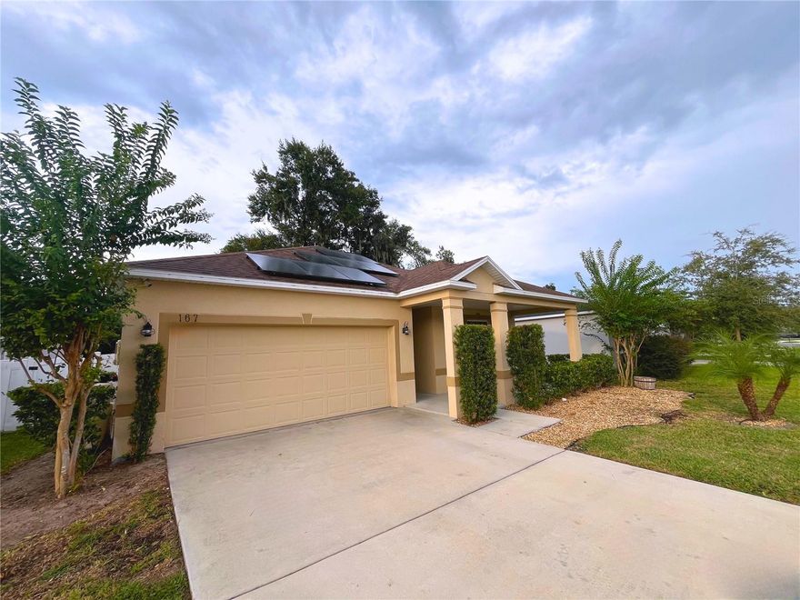 Enjoy low electric bills thanks to the solar panels that power this home! This 3-bedroom, 2-bath property in DeLand combines style, comfort, and convenience. The interior showcases a modern kitchen backsplash and elegant accent walls in the living room and primary suite. Step outside to a private backyard retreat with a screened, tiled lanai, landscaped yard, and full vinyl fencing. Located just minutes from downtown DeLand and the Historic Garden District, this home is the perfect blend of charm and efficiency.