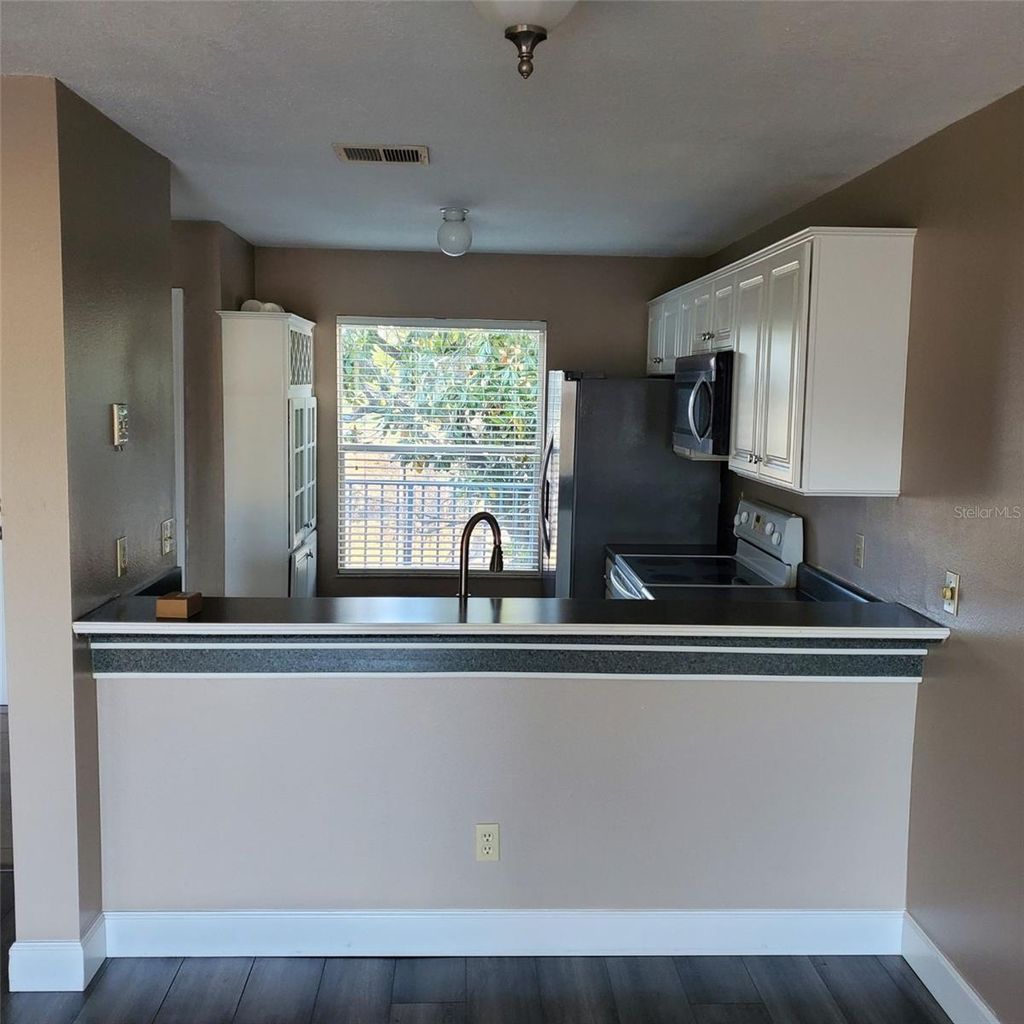 Photo of 2504 Woodgate Boulevard #205, Orlando, FL 32822 (MLS # O6401750)