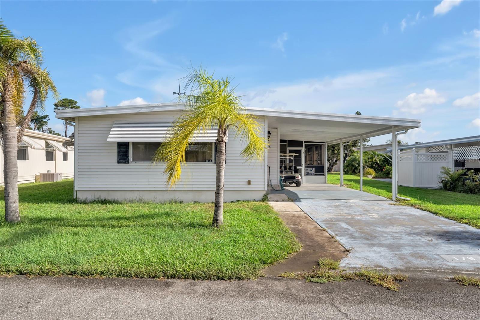Welcome to the 55+ community of Molokai Co-Op Mobile Home Park, where residents enjoy a wide range of amenities. This fully furnished 2-bedroom, 2-bathroom home features a screened-in porch with vinyl windows, as well as a spacious Florida Room—perfect for relaxing or entertaining. A new A/C unit was installed in 2021 for added comfort. Don’t miss out—schedule your showing today!